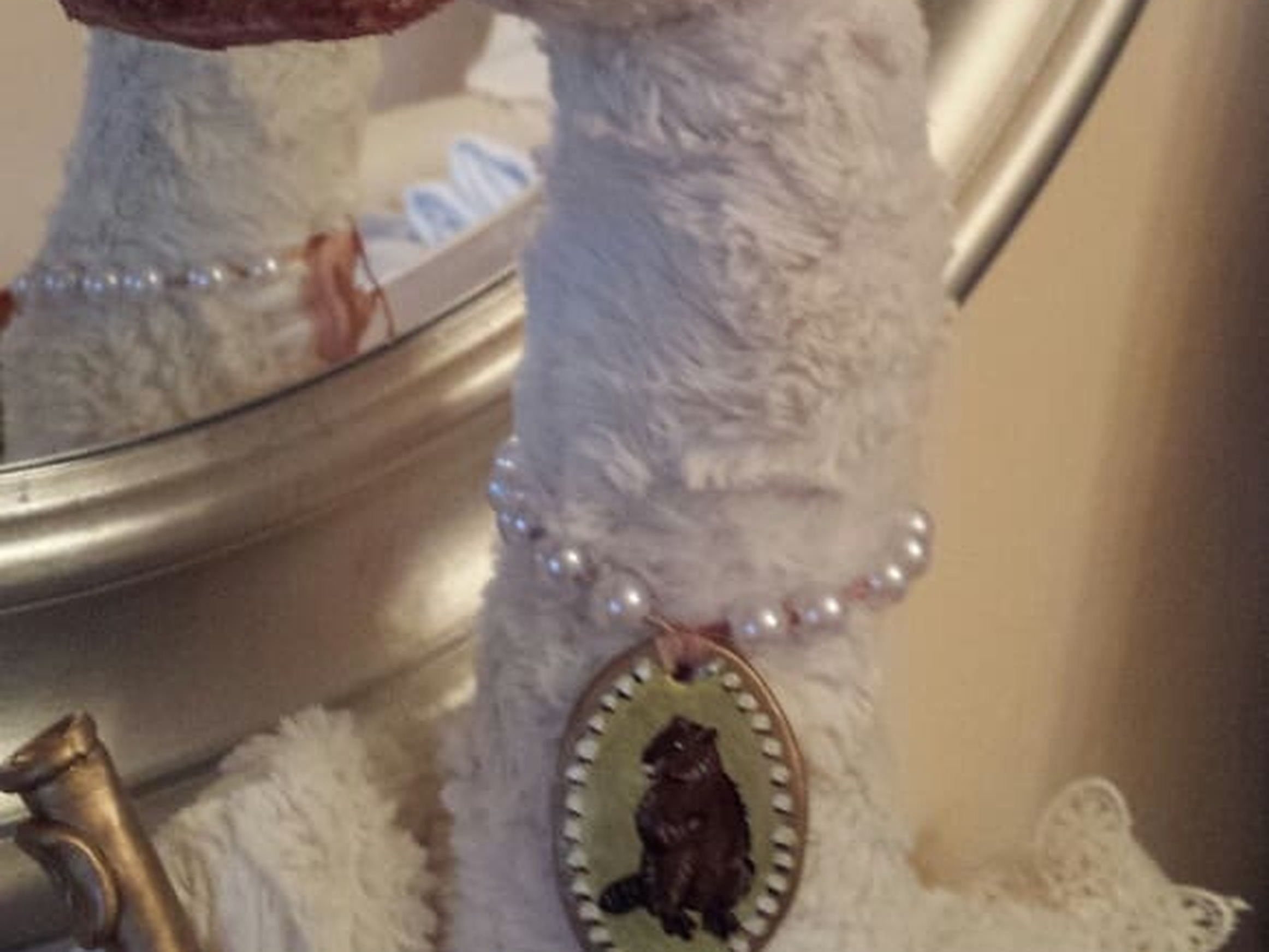 Pearl necklace and cameo on a custom goose plush Pearl necklace with a cameo pendant and a golden flute on a handmade goose plush, a custom plush gift for her
