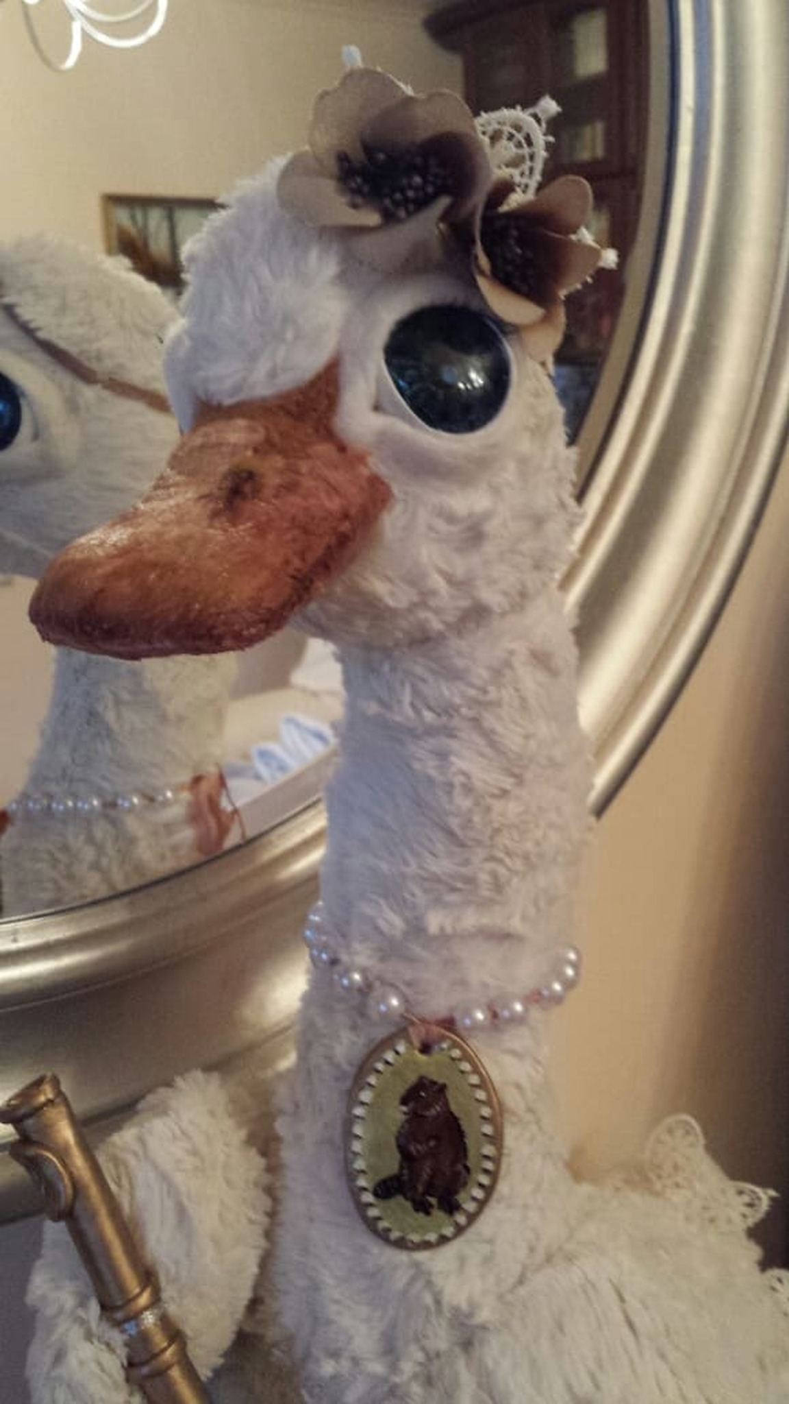 Custom goose plush with a pearl necklace and cameo pendant, fabric flowers on the head, handmade to order