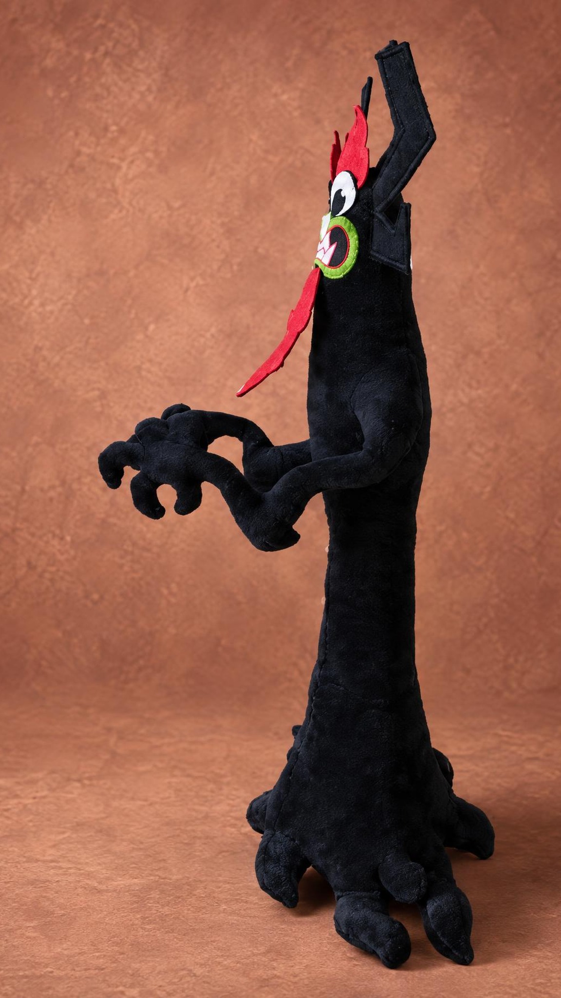 Aku plush in profile with his long red flame beard and curled claws, a Samurai Jack villain made to order