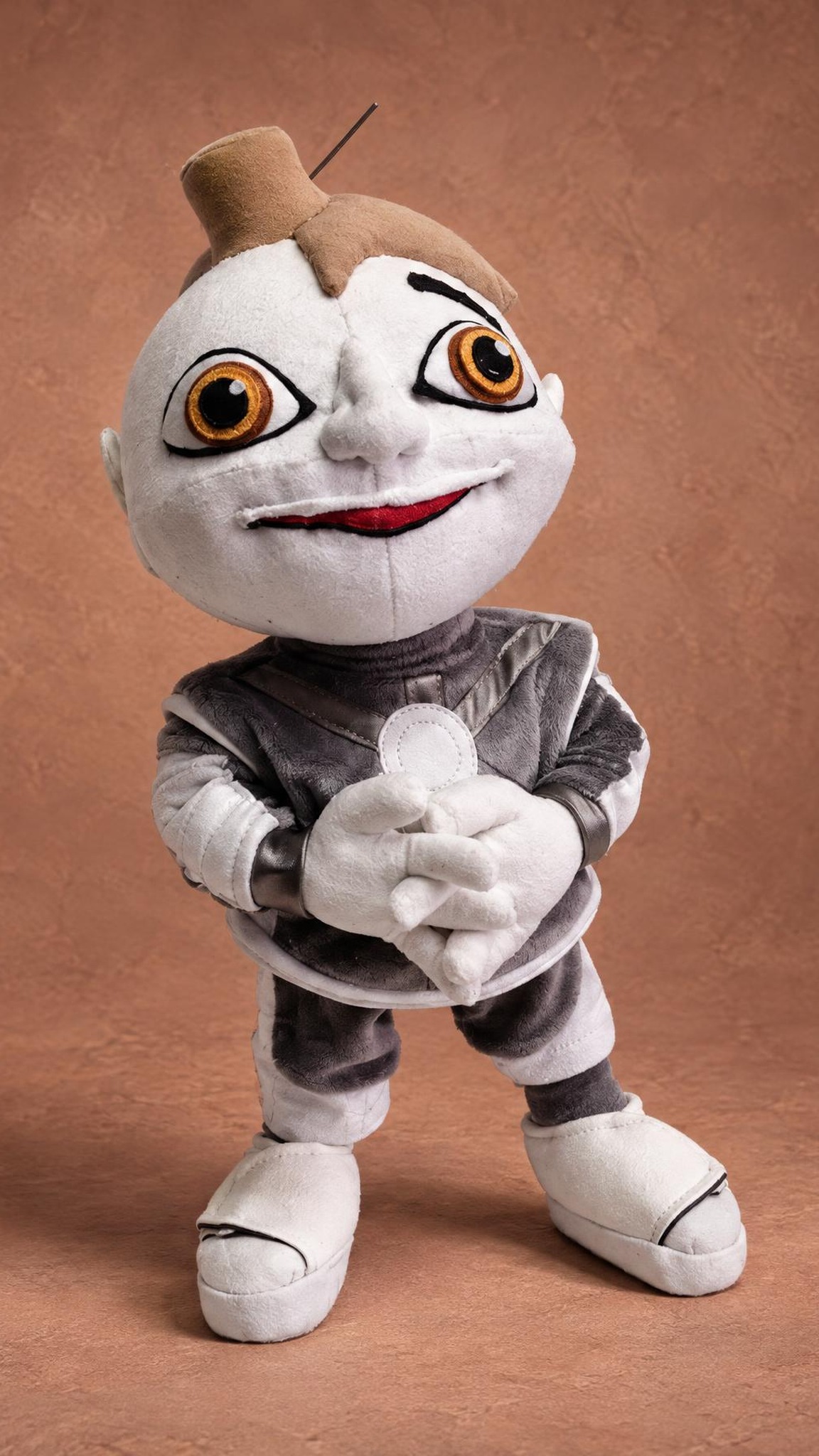 Arif 216 plush with big orange eyes and an embroidered smile, a custom Arif V 216 soft toy made to order