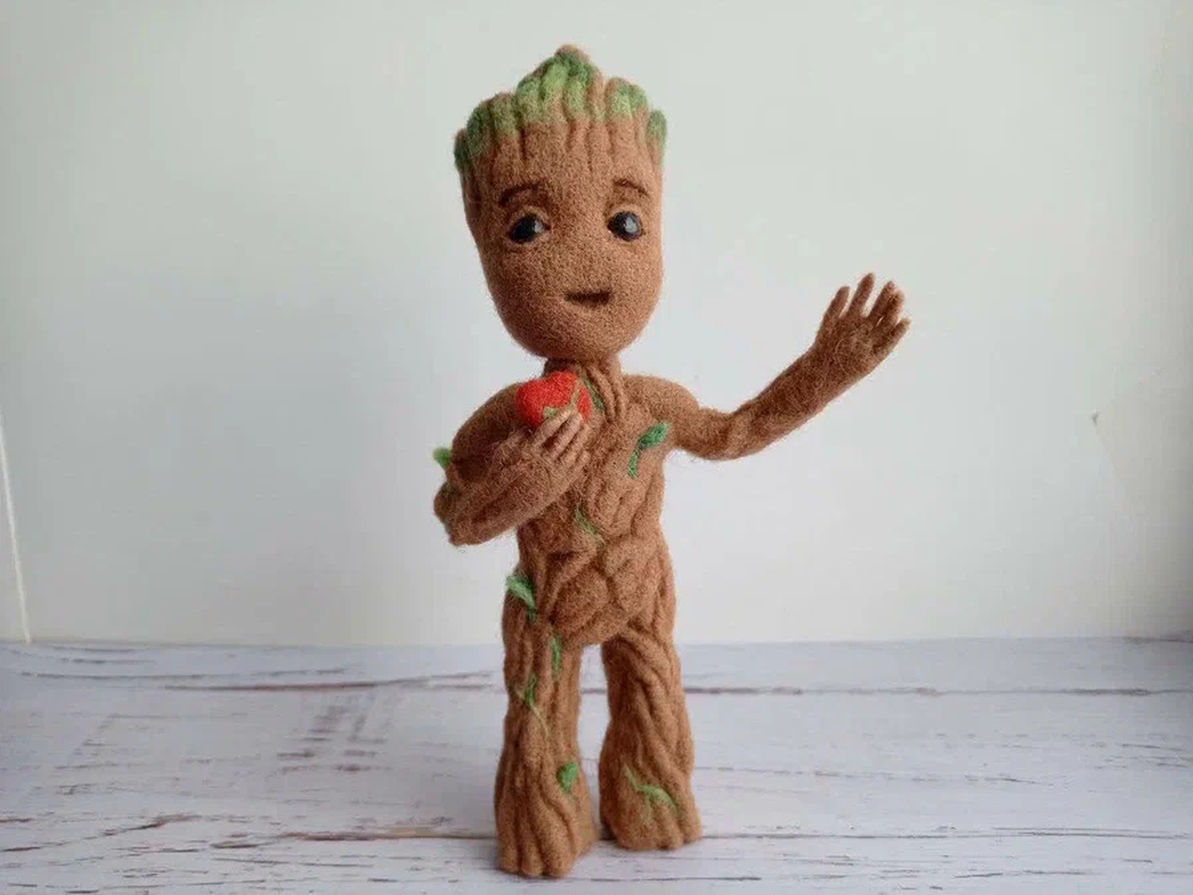 Baby Groot plush holding a red heart Baby Groot plush holding a small red heart to his chest, a needle-felted Marvel fan toy made to order