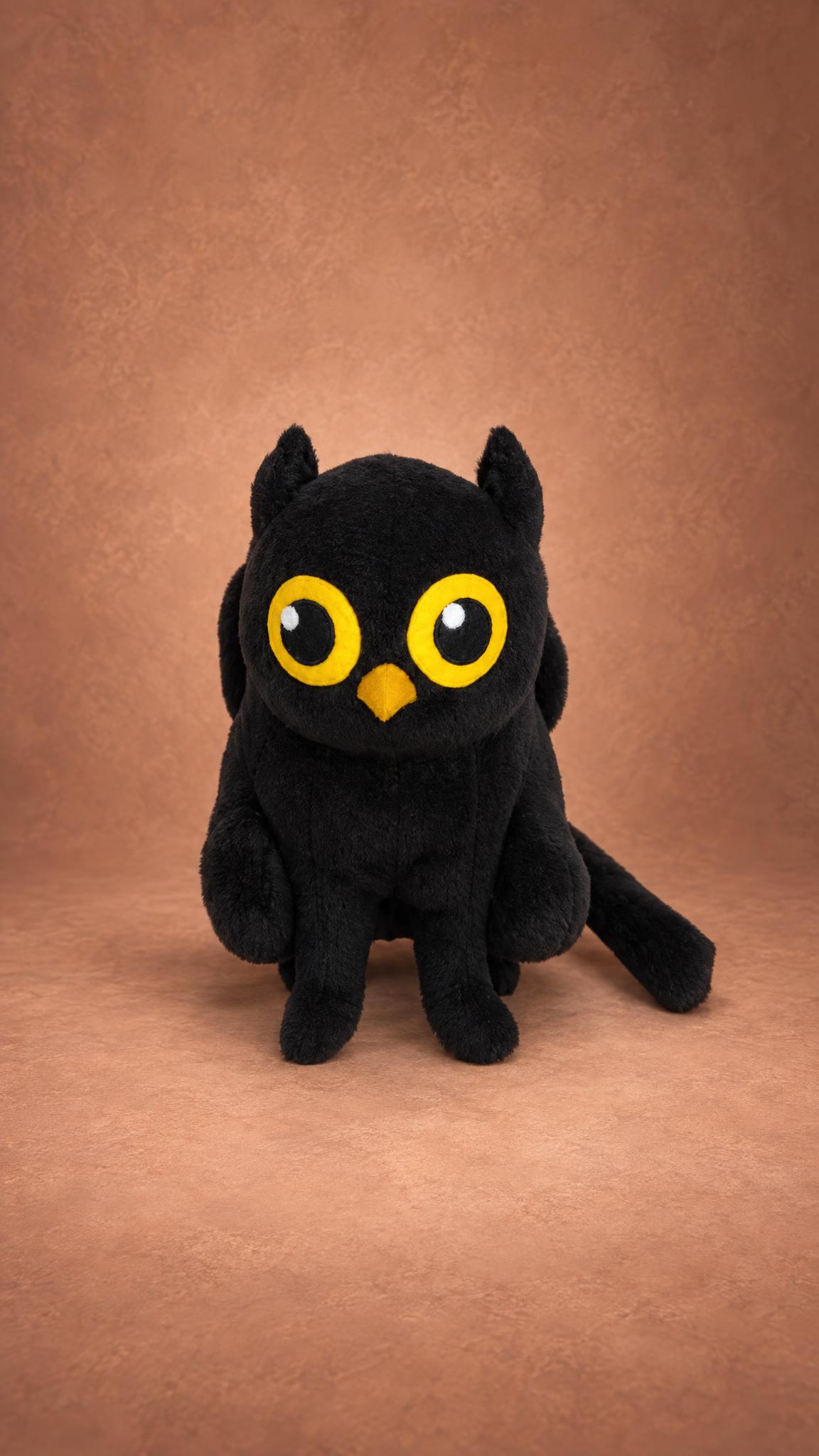 Black owl-cat custom mascot plush Custom mascot plush of a black owl-cat, sewn by hand from a company logo: huge yellow eyes, orange beak