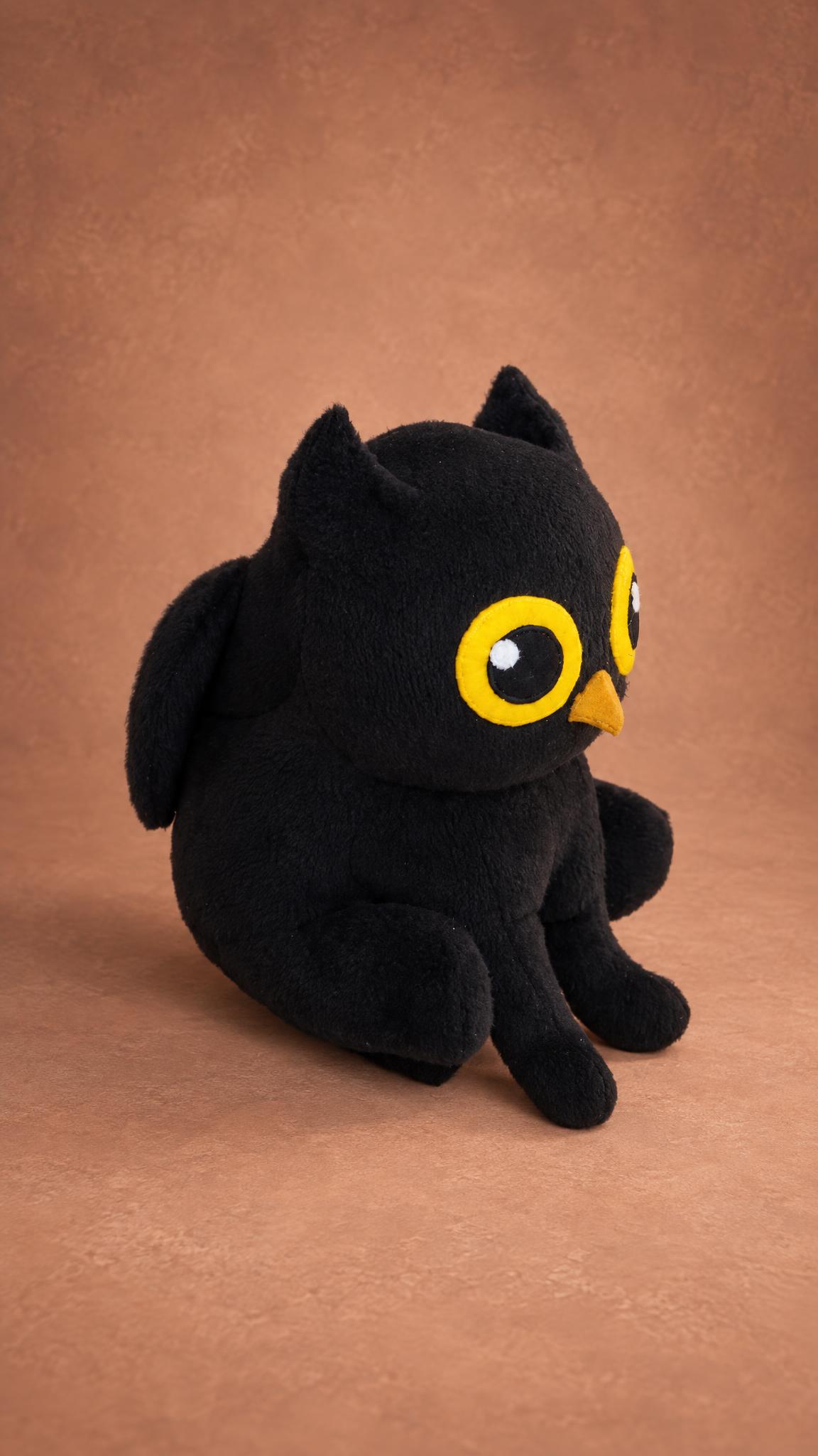 Black owl-cat plush sewn as a company mascot sample, made to order: cat legs and paws, wing, yellow owl eyes