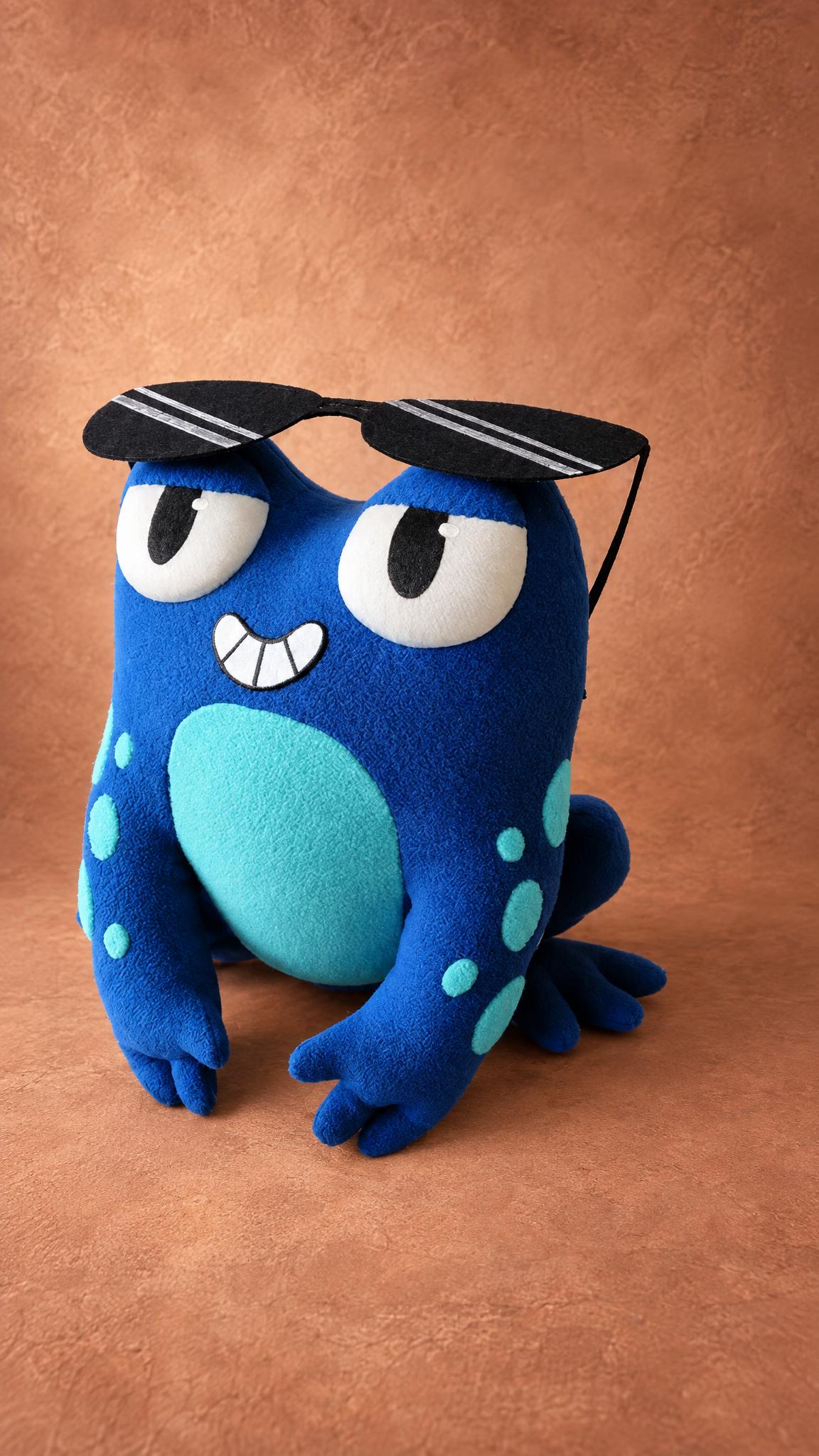 Custom blue frog plush toy with a spotted belly, sewn by hand to order from a drawing