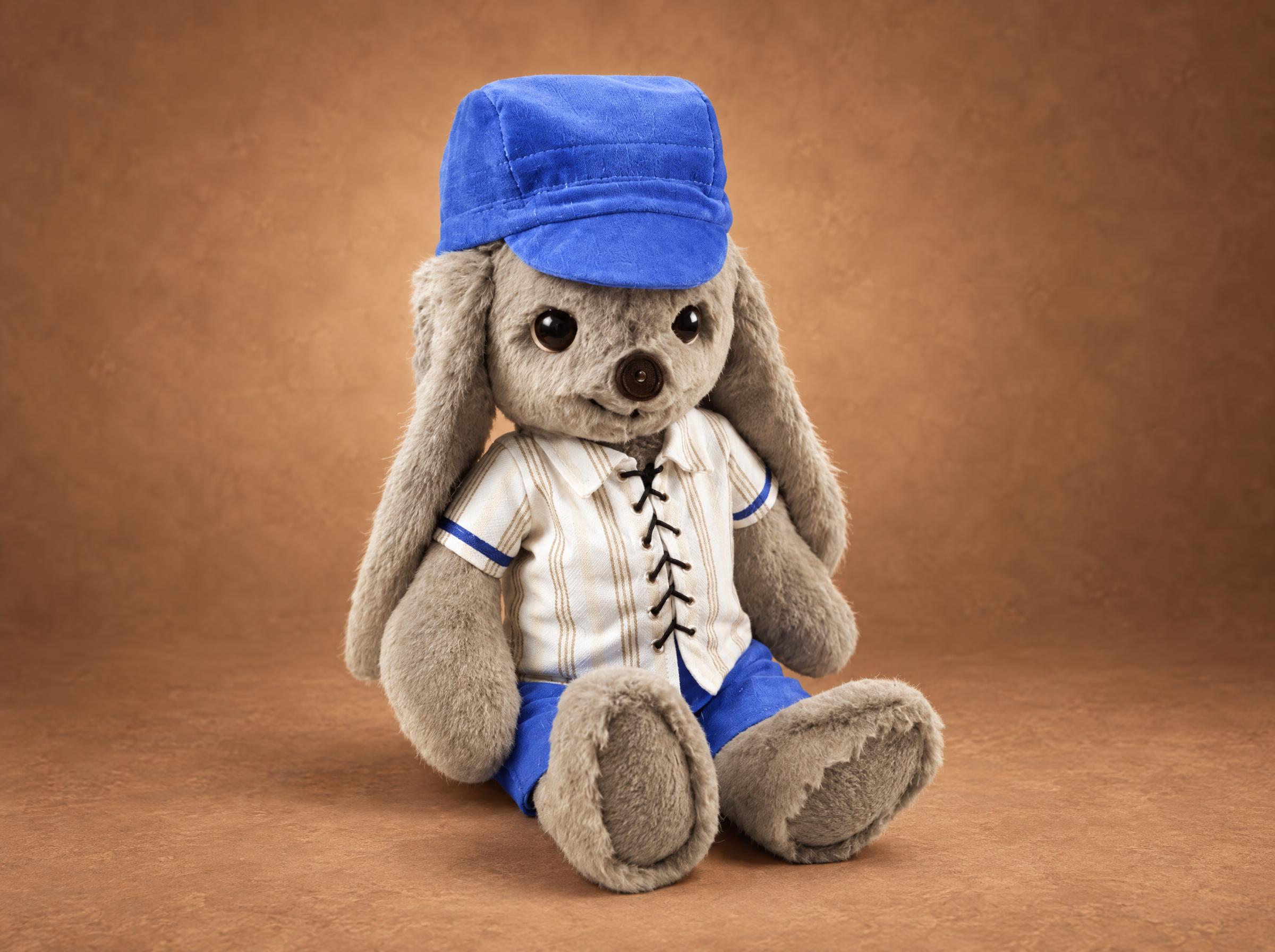 Handmade bunny plush made to order from a child's drawing, grey fur, laced white shirt and blue cap