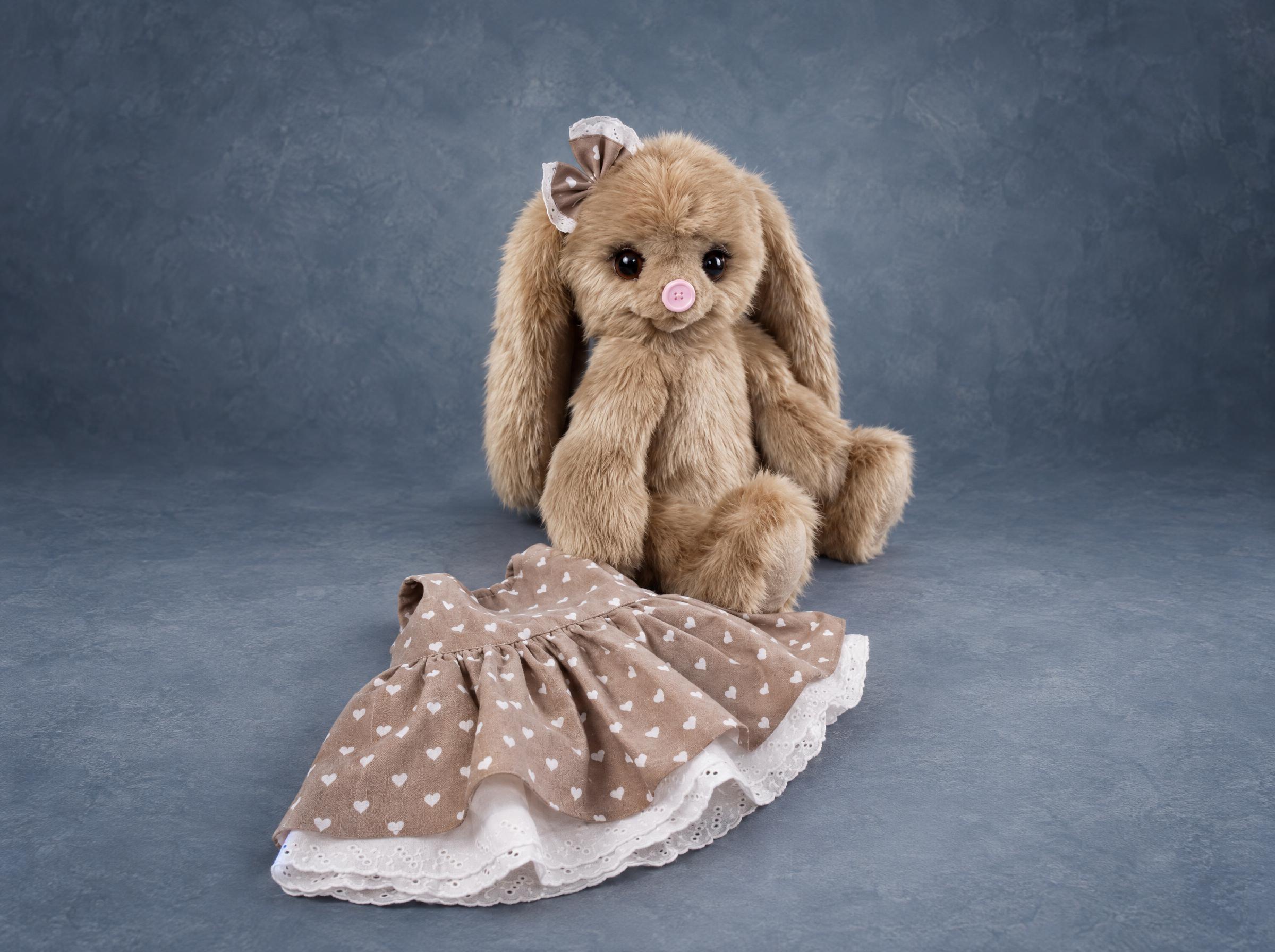 Bunny plush prototype with removable dress Bunny plush prototype with its removable heart-print dress beside it, teddy-style, made to order for a brand