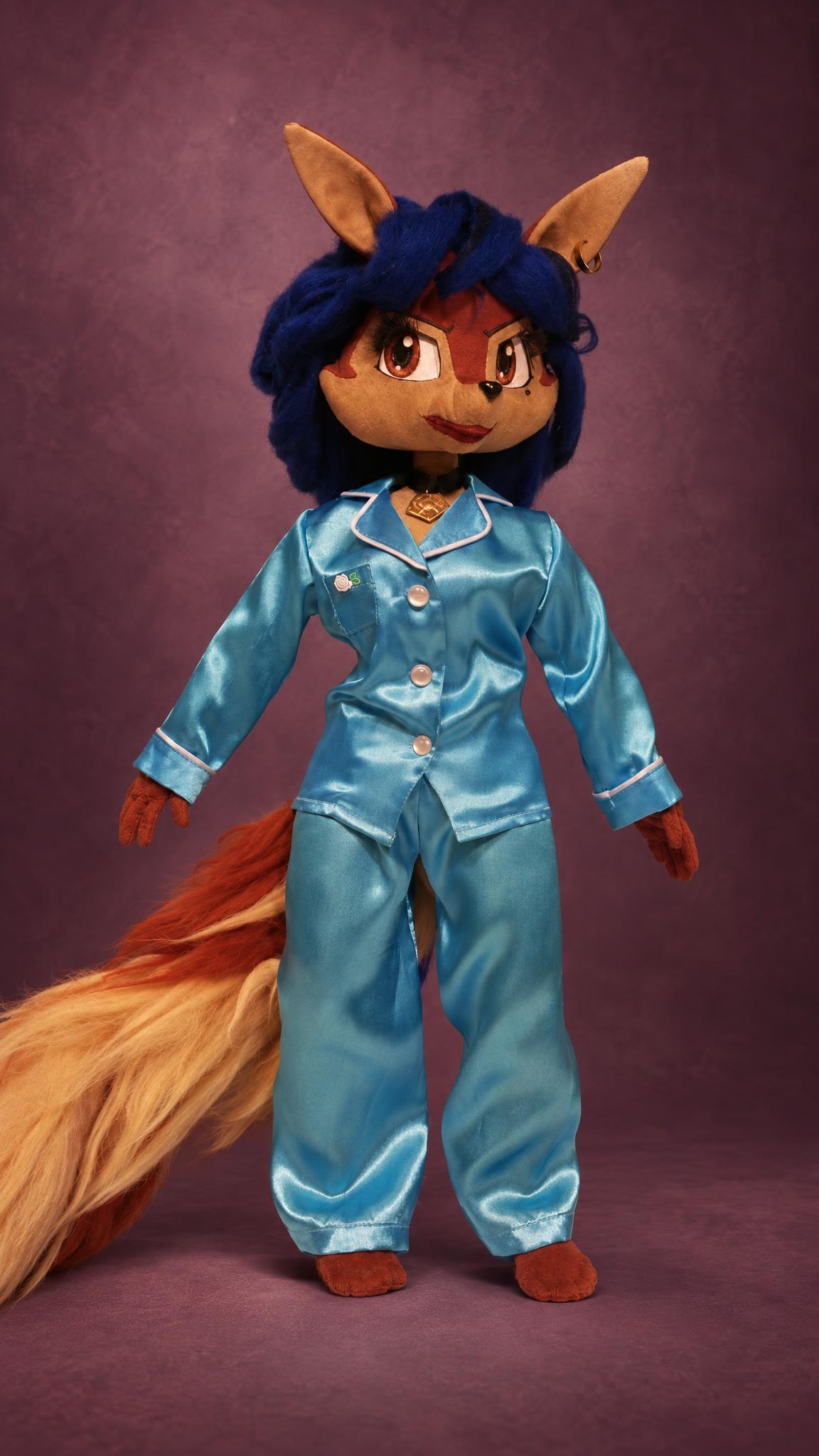 Custom Carmelita Fox doll in blue satin pajamas, one outfit from her handmade wardrobe, a Sly Cooper doll