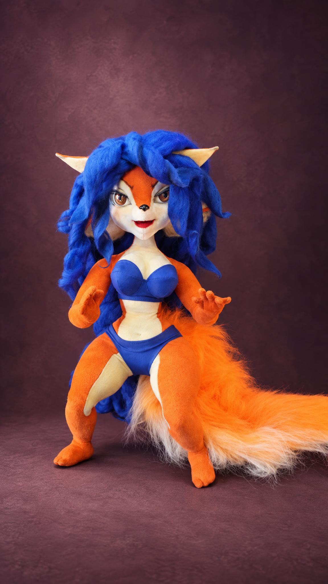 Custom Carmelita Fox doll in a blue two-piece with a big fluffy orange tail, a handmade Sly Cooper doll