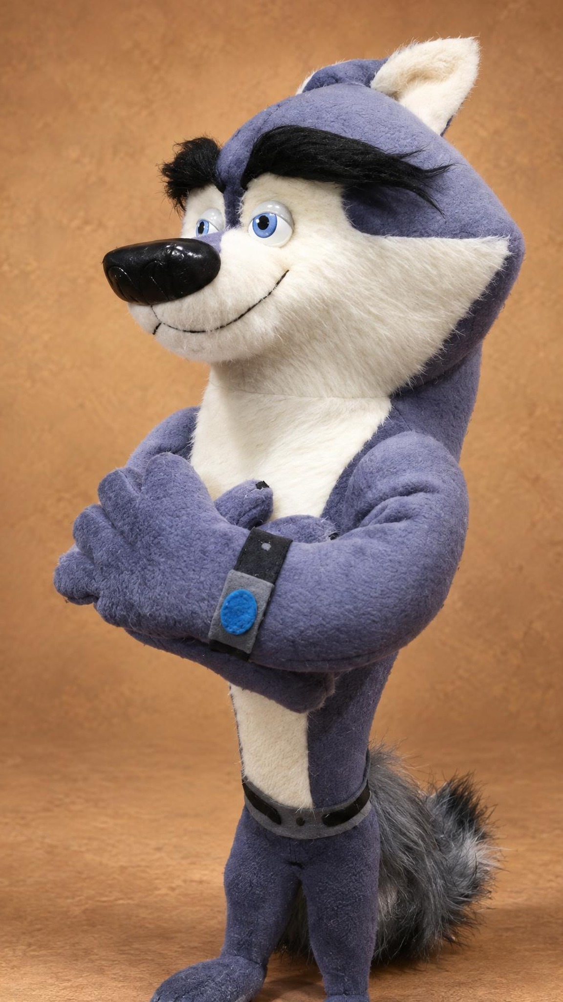 Handmade Classified plush with a North Wind wrist band and crossed arms, a DreamWorks wolf sewn to order