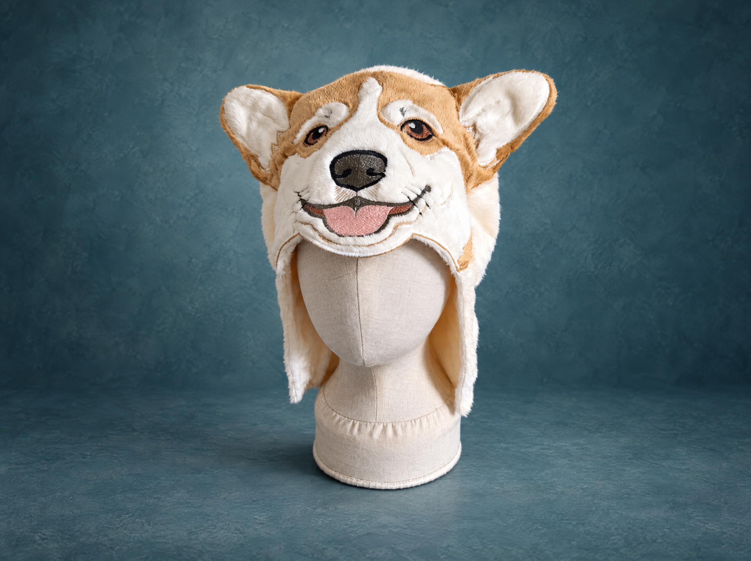 Corgi dog hooded towel prototype, handmade to order: cream and ginger plush, embroidered smile, on a mannequin