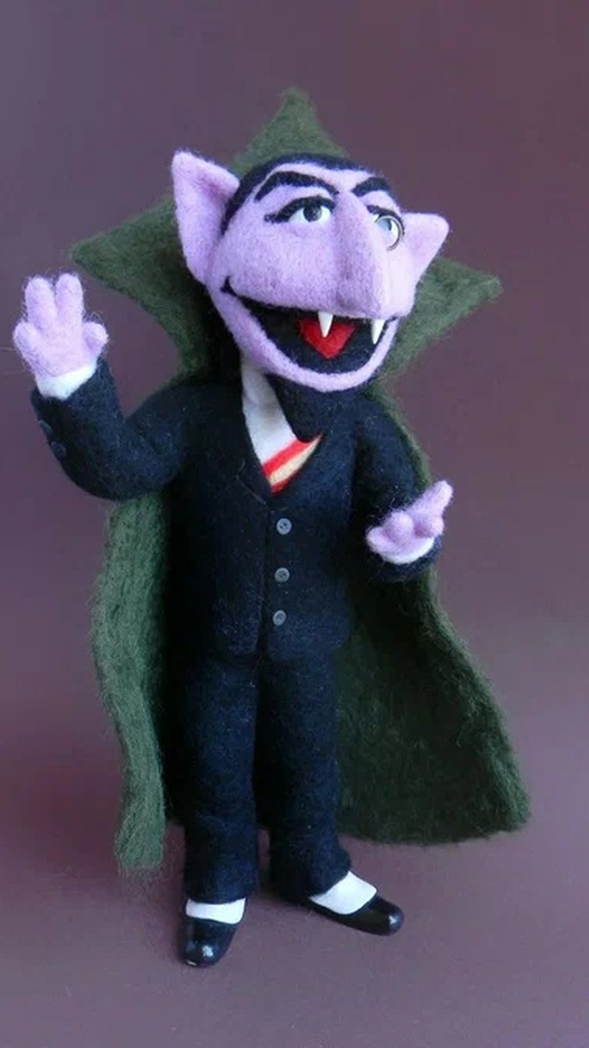 Sesame Street Count doll, needle-felted by hand to order, waving in his black suit and tall green cape