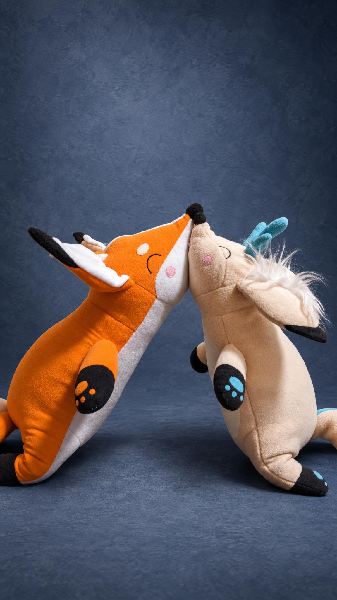 Couple Plushies, Two Foxes Leaning In Custom couple plushies: an orange fox and an antlered cream fox leaning in nose to nose, made to order