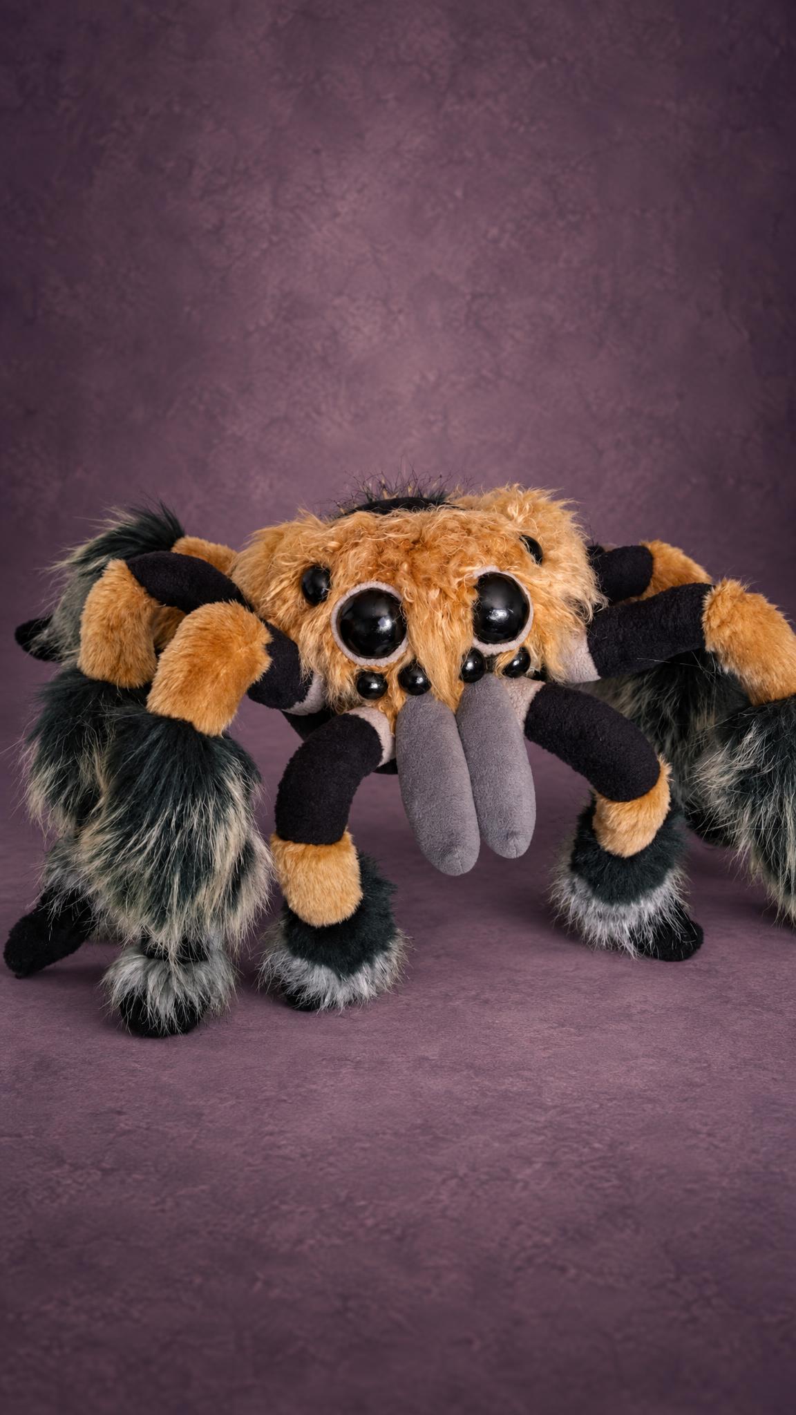 Custom fluffy spider plush with shiny eyes and striped legs, handmade to order