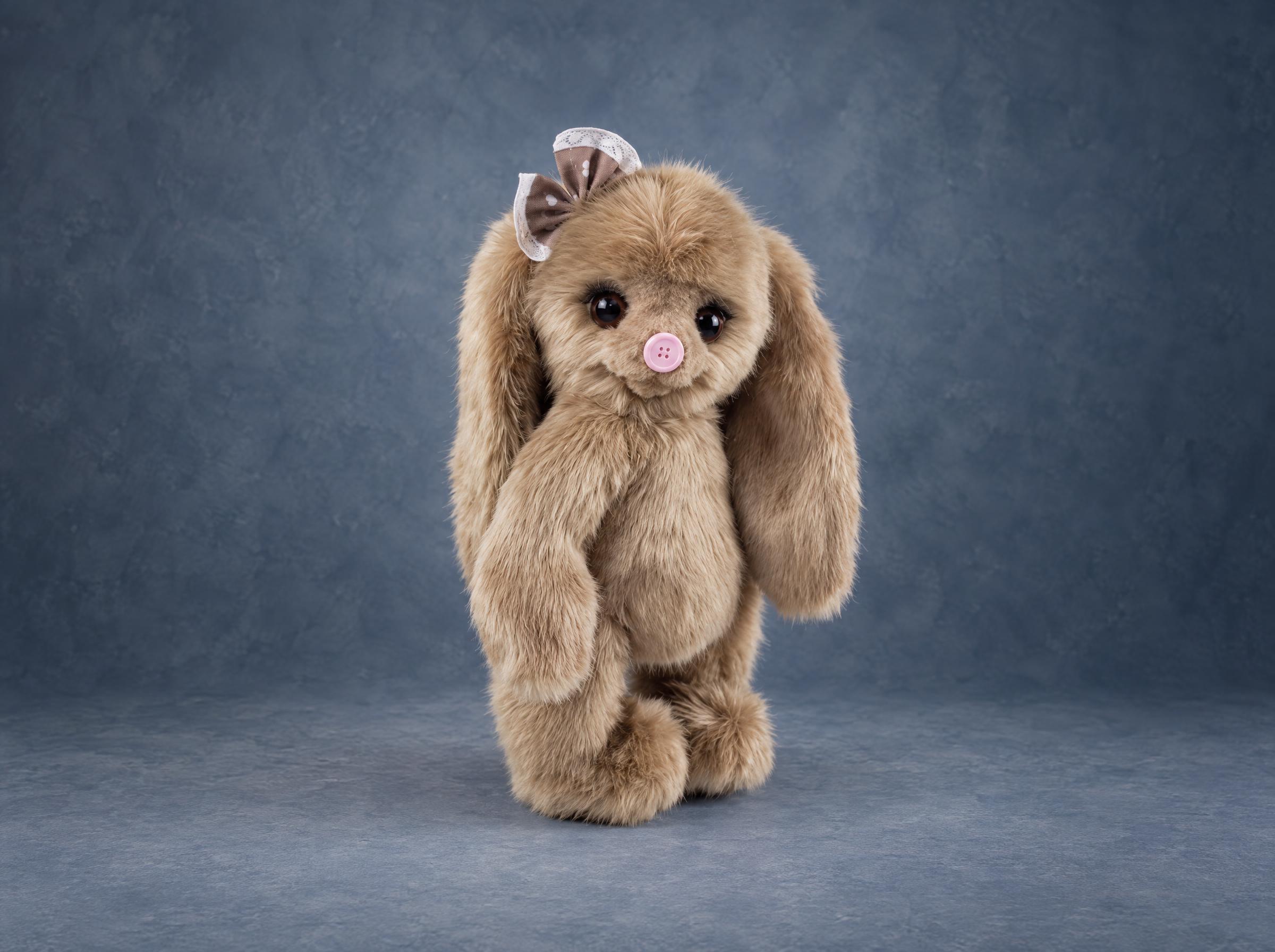 Custom bunny plush sample for a toy brand Custom bunny plush sample for a toy brand, beige faux fur, long ears and a pink button nose, handmade