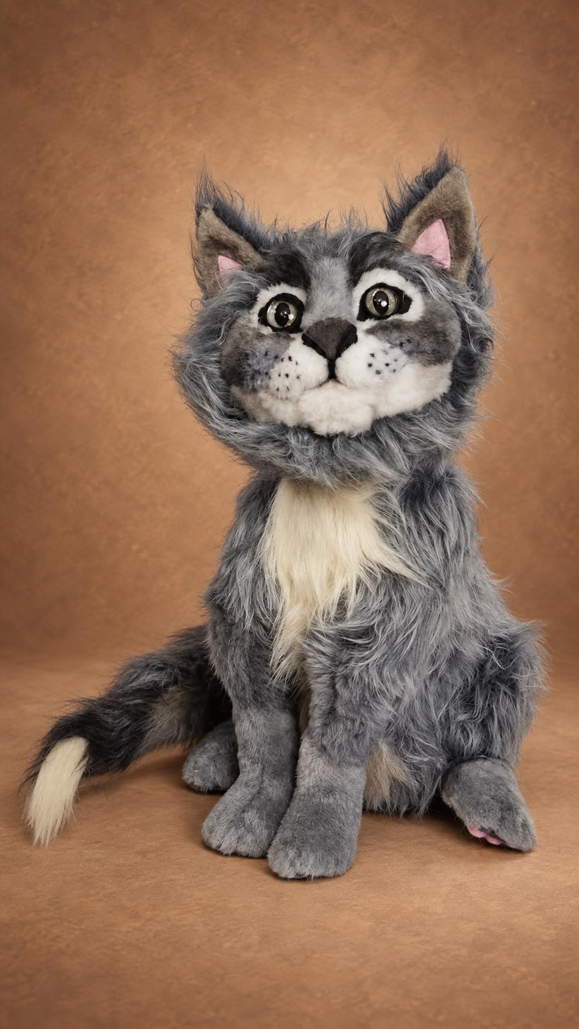 Handmade grey cat plush with dark eye markings and a fluffy cream bib, a pet portrait toy sewn to order