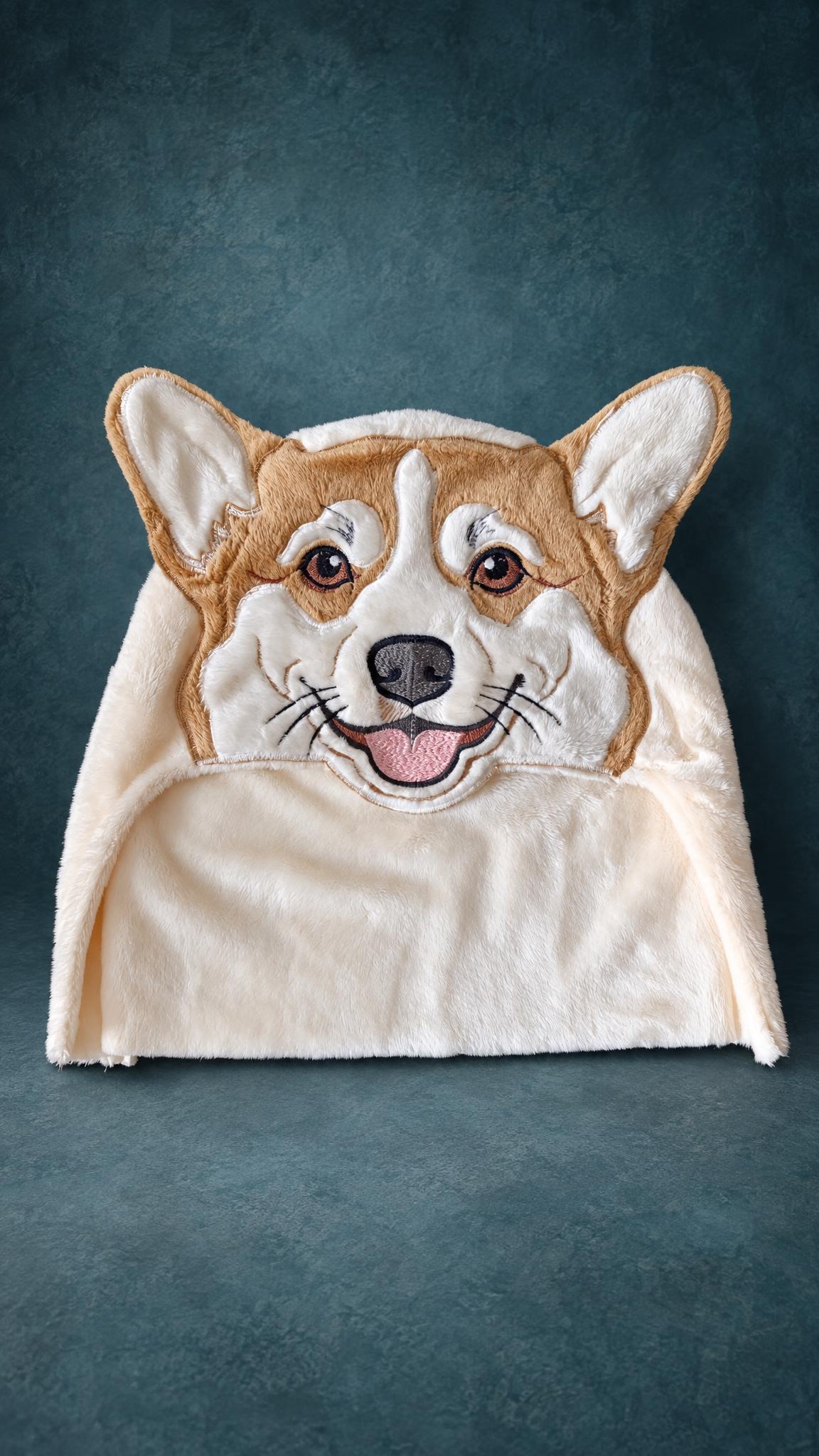 Custom hooded towel sample with a corgi face, made to order: embroidered eyes, whiskers, pink tongue on plush