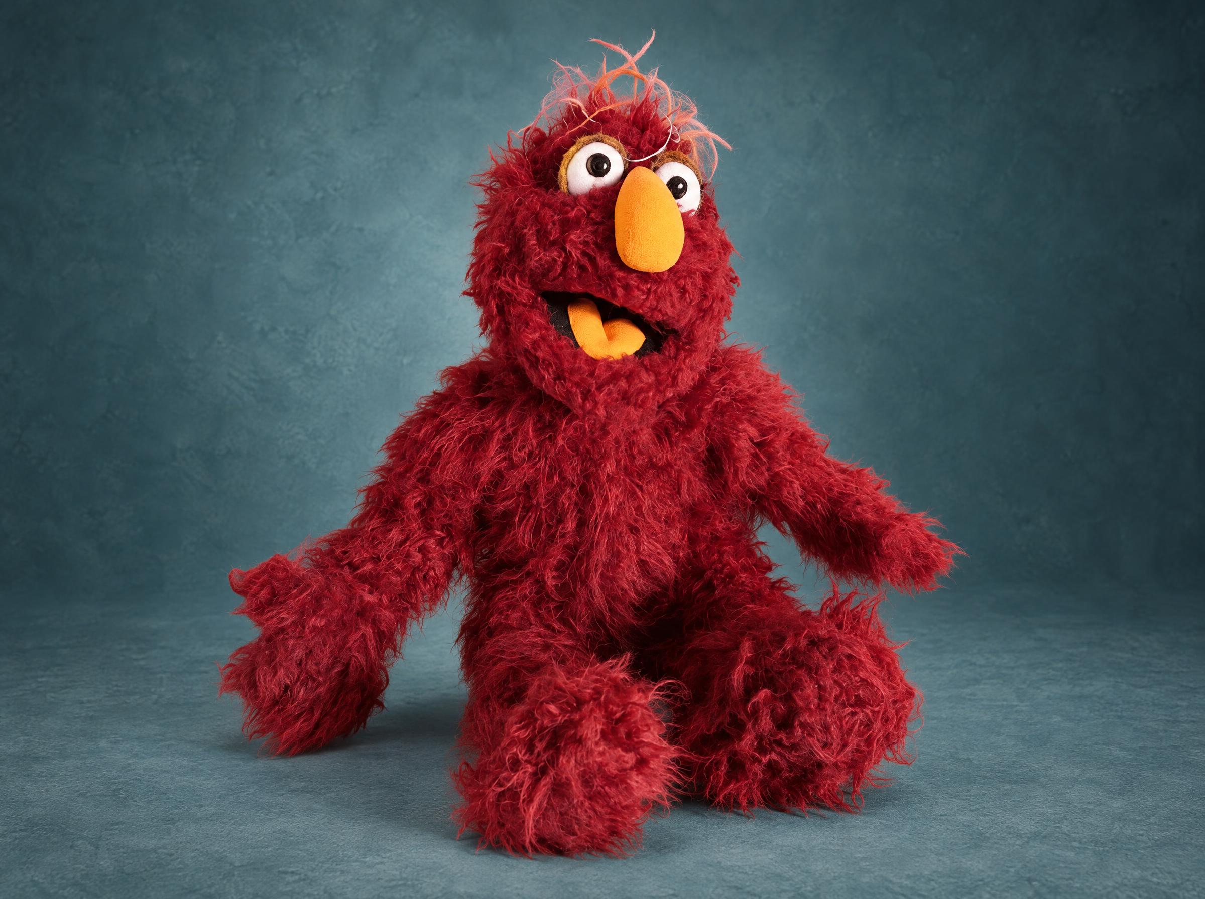 Custom Muppet-style monster plush made to order, shaggy crimson fur, orange nose and tongue, wispy hair tuft