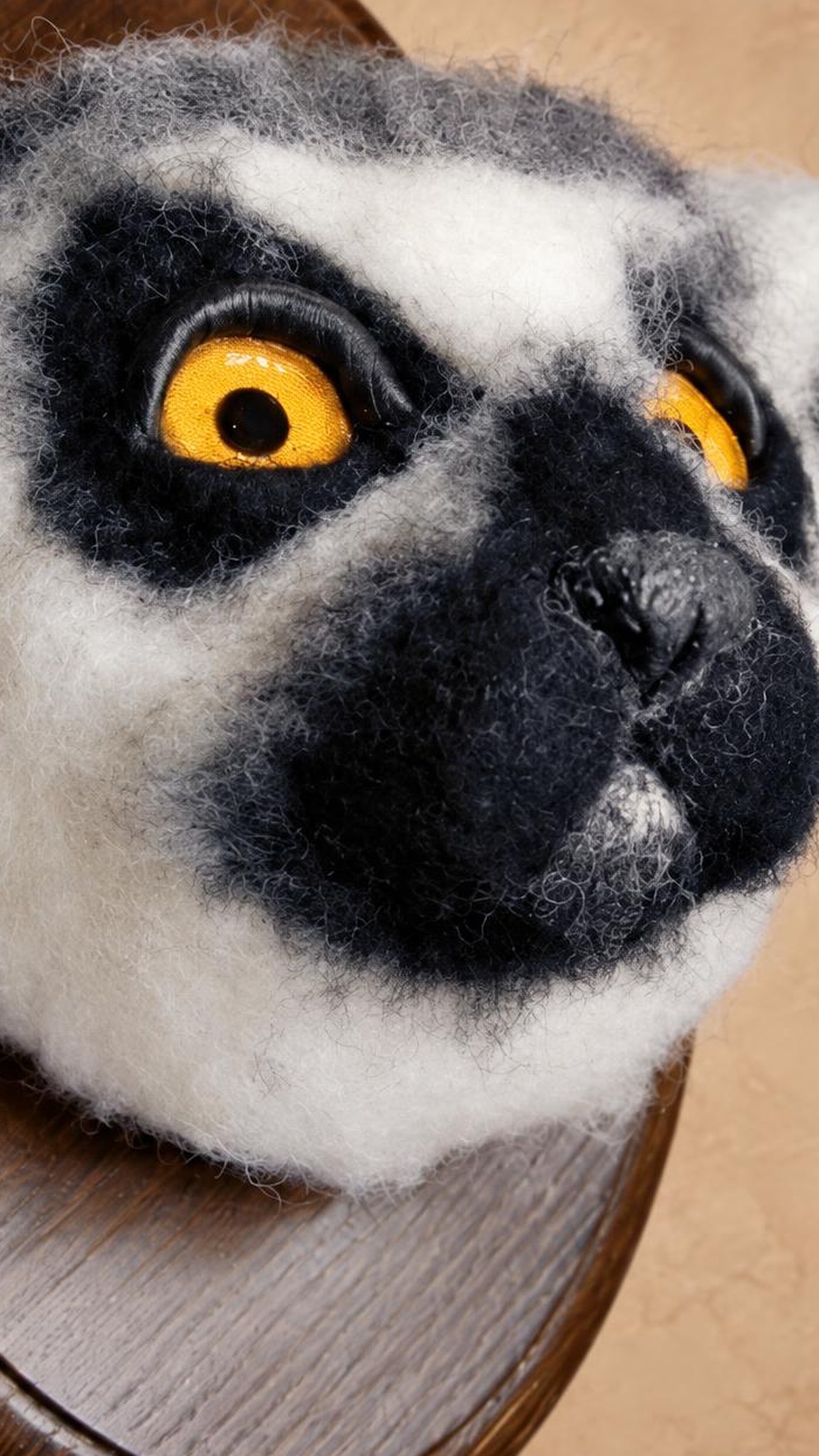 Custom lemur plush head in needle-felted wool, handmade faux taxidermy with amber eyes and a black muzzle
