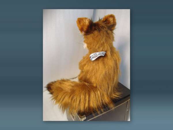 Custom Stoned Fox meme plush, a faux taxidermy fox with a bushy dark-tipped tail and a gift ribbon on its back