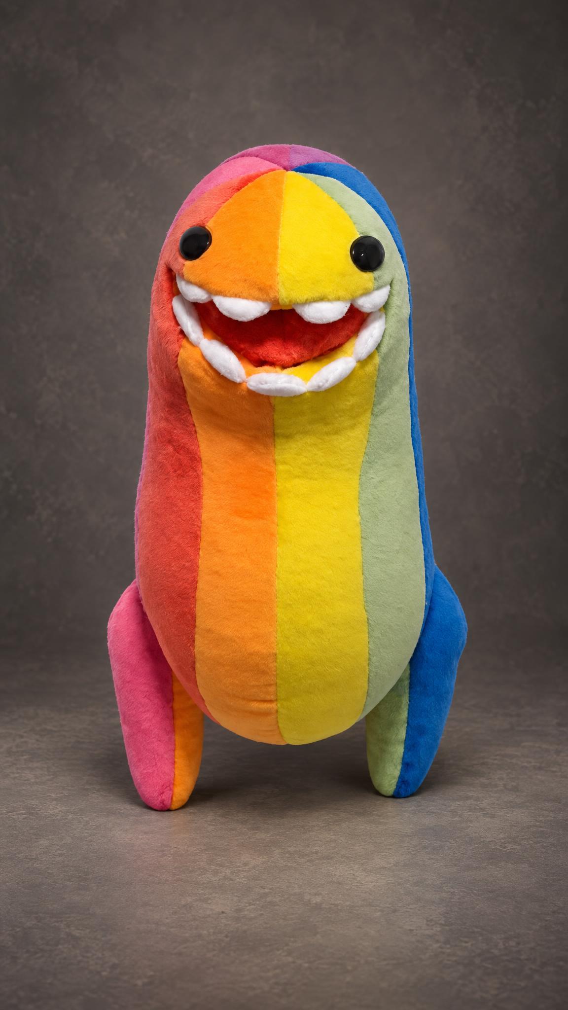 Cute rainbow monster plush, custom made from a drawing: black bead eyes, big smile, pink, green and blue legs