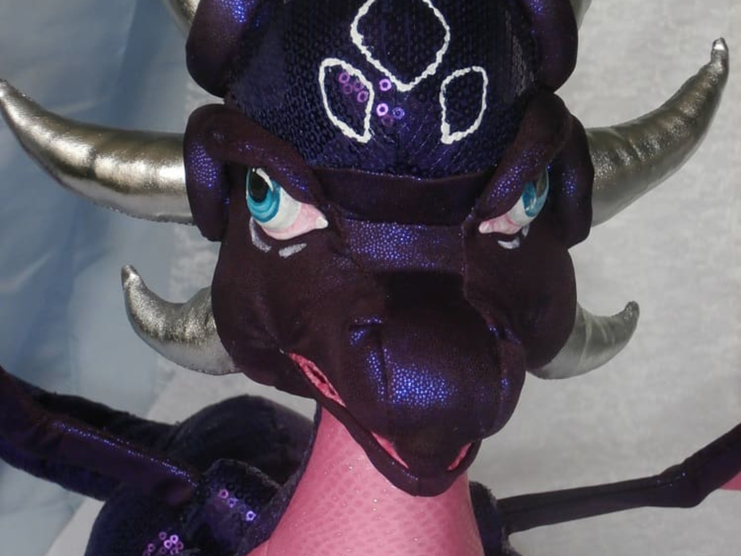 Cynder Plush Head Cynder plush head with silver horns, sequined forehead markings and teal eyes, a custom Legend of Spyro plush