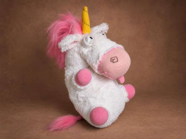 Handmade fluffy unicorn plush with a long pink faux-fur tail and yellow horn, Despicable Me, made to order