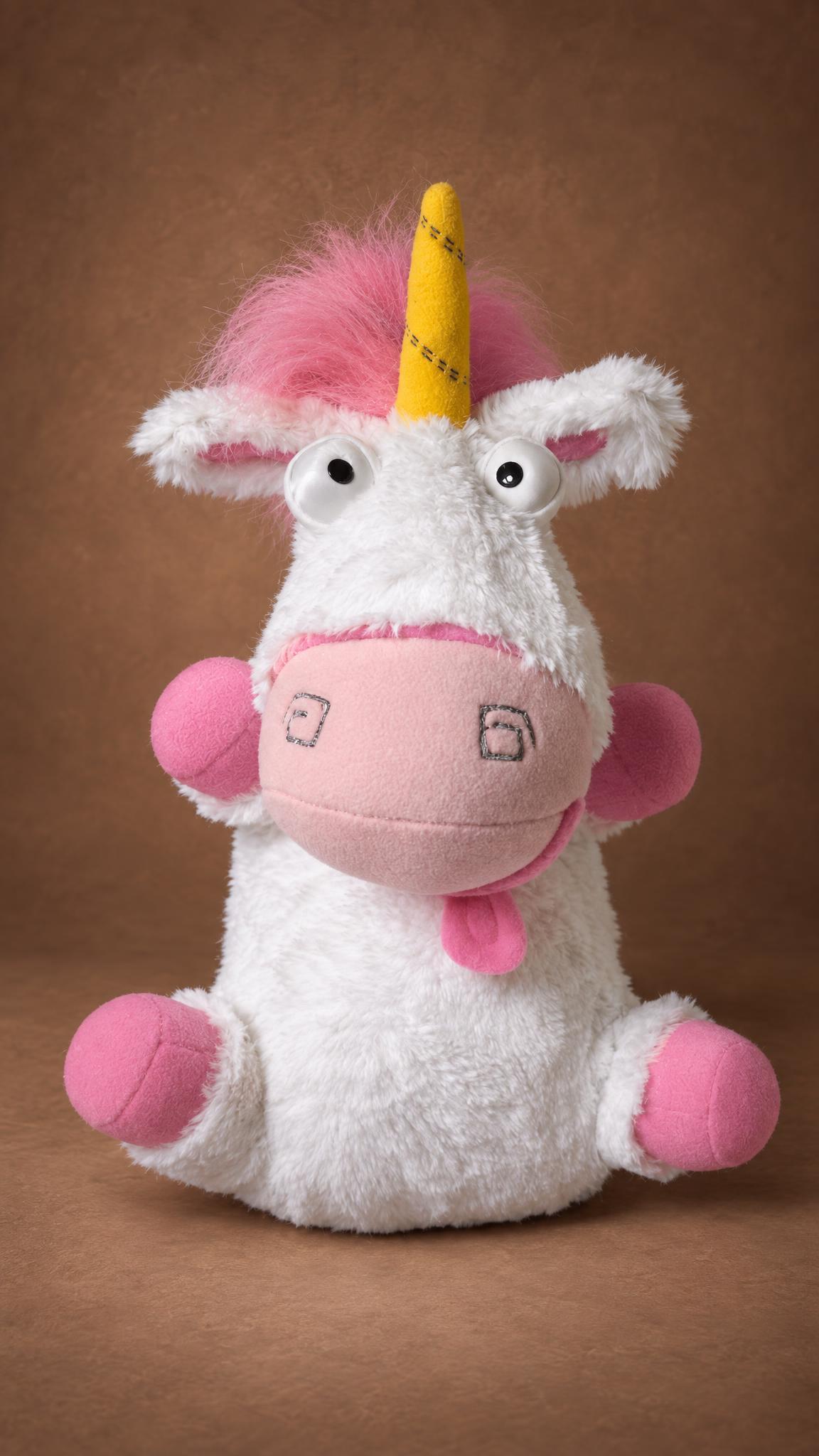 Custom Despicable Me unicorn plush in shaggy white faux fur with googly eyes and pink paws, made to order