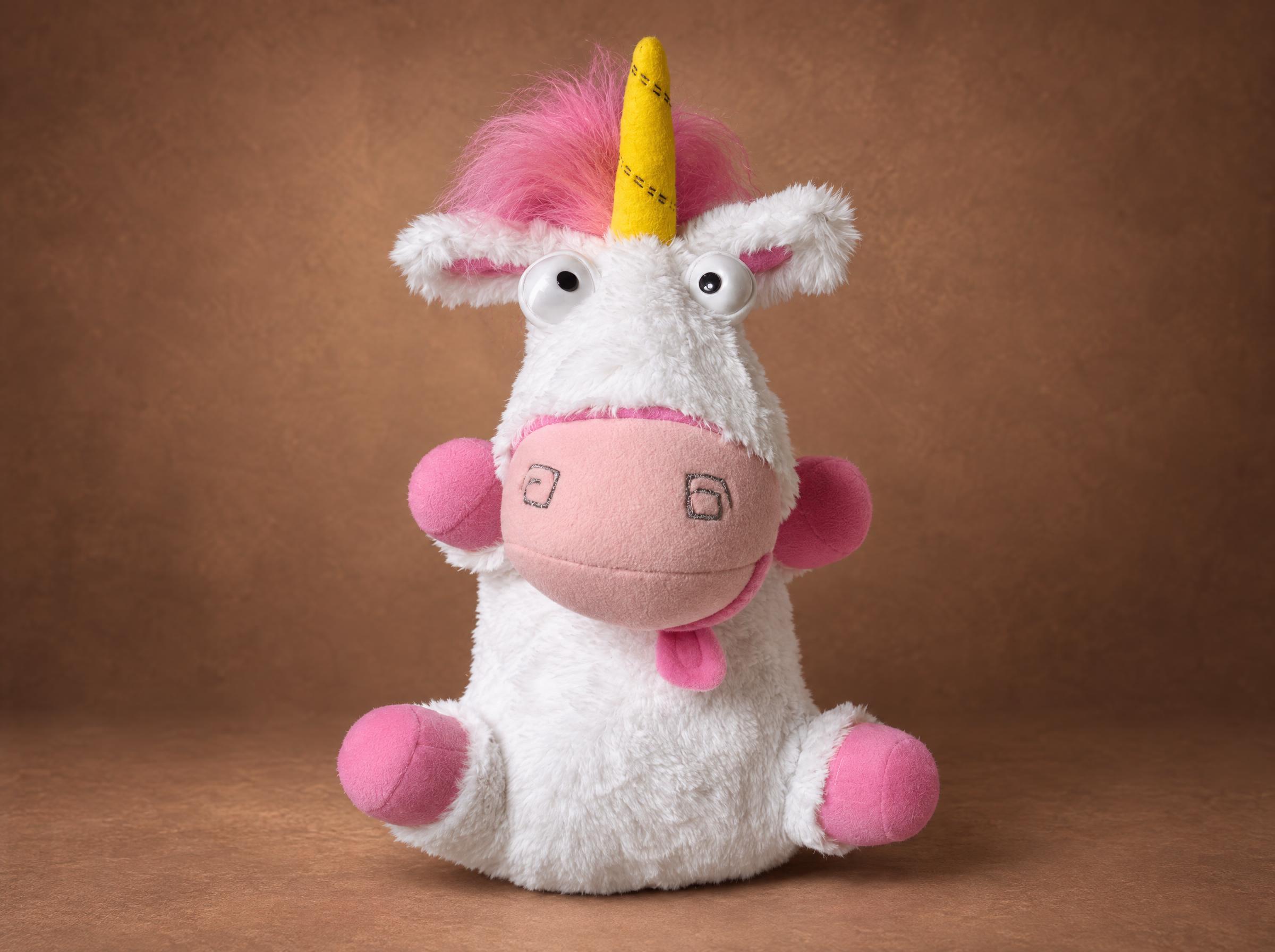 Fluffy unicorn plush from Despicable Me with a pink mane and yellow horn, handmade to order, about 50 cm