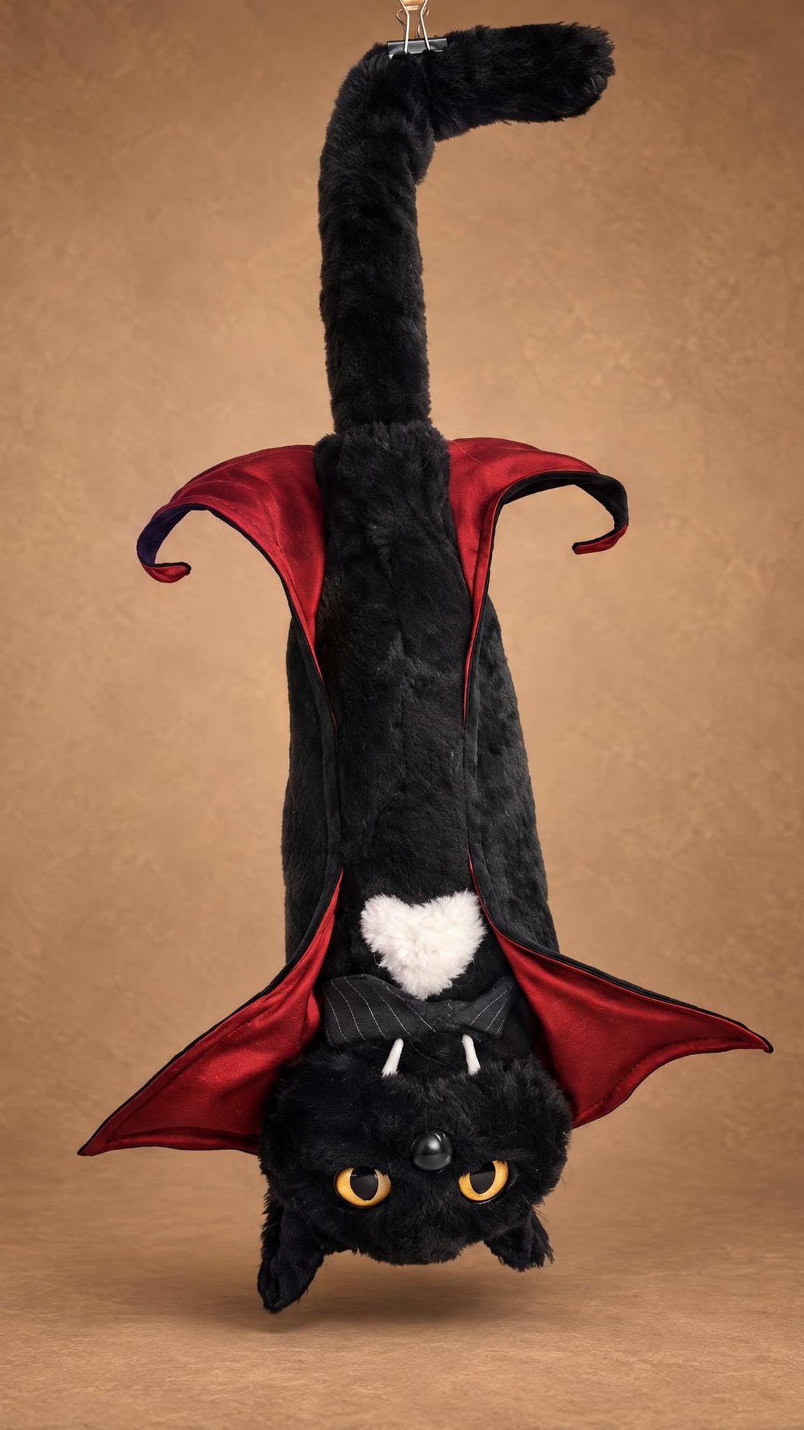 Dracula cat plush hanging upside down like a bat, cape spread, a spooky meme cat sewn to order