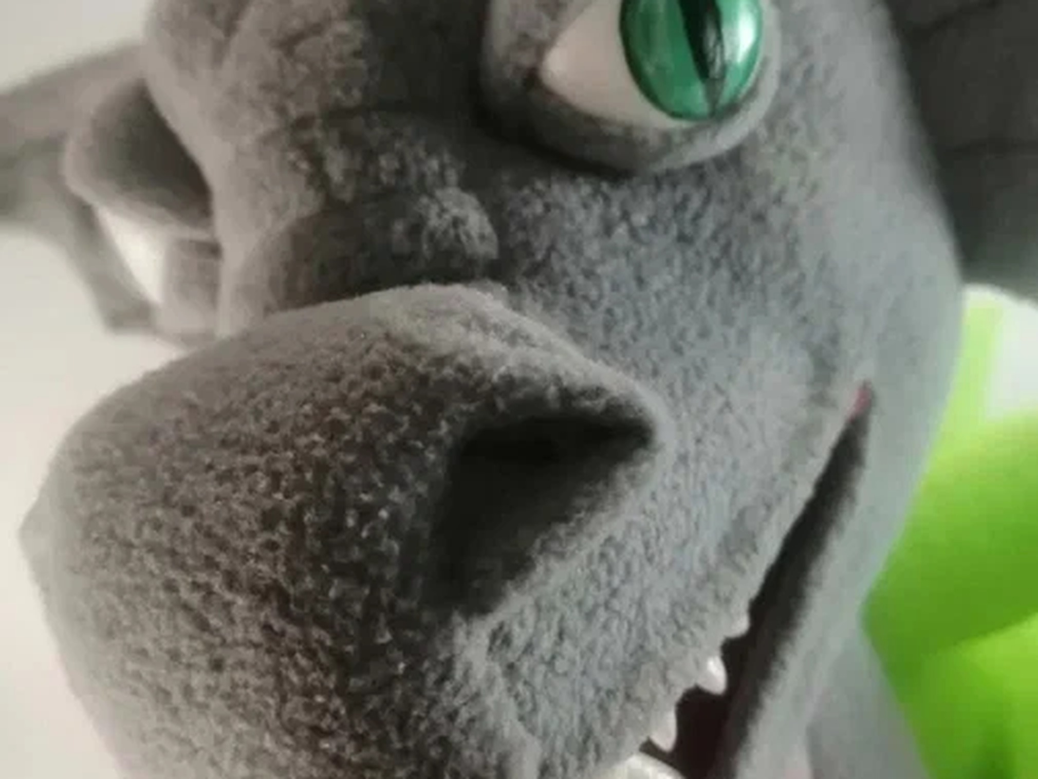 Esports dragon plush snout and teeth Esports dragon plush snout in soft gray fleece with white teeth and a green slit eye, a handmade mascot to order