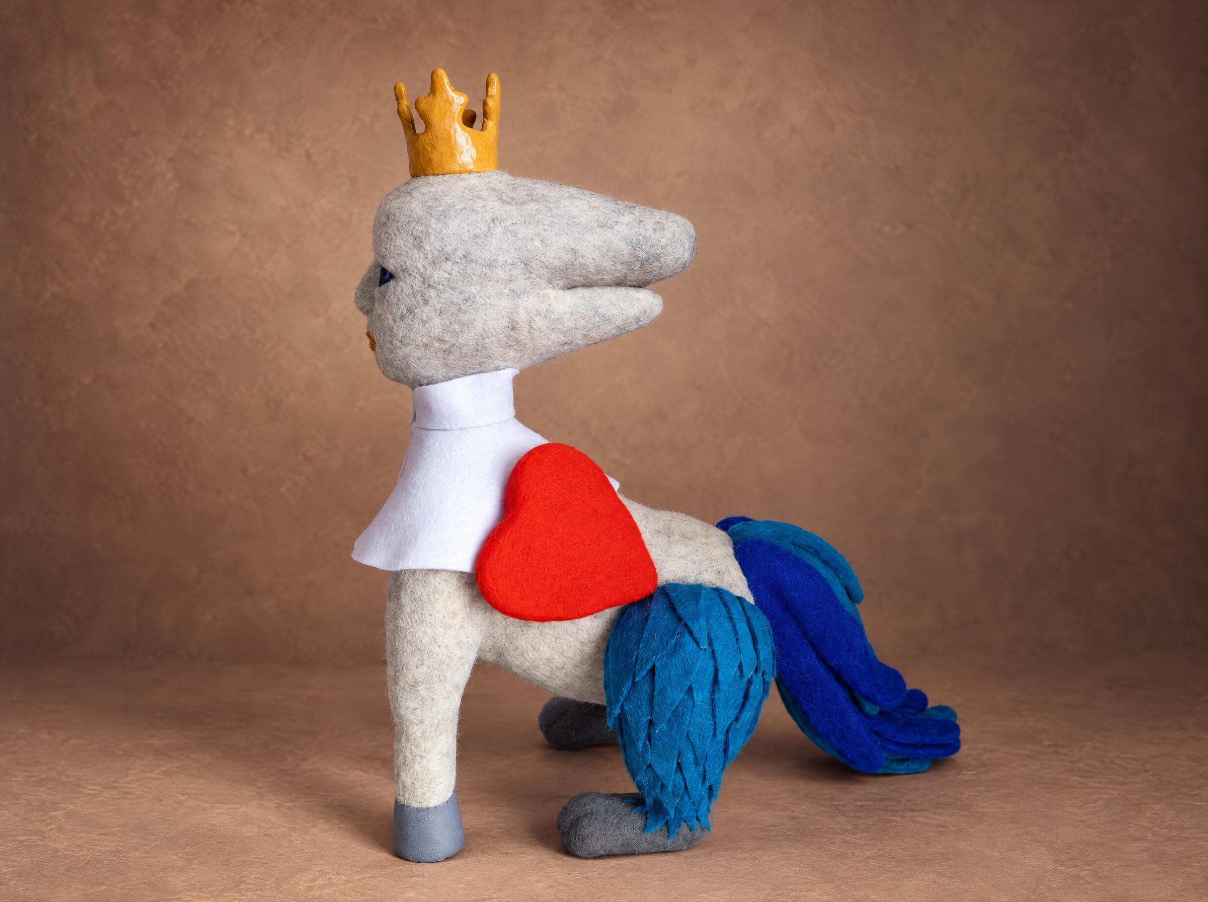 Fantasy creature plush, red heart and blue feathers Fantasy creature plush with a red felt heart on its side and blue felt feathers on the back legs, felted to order from a painting