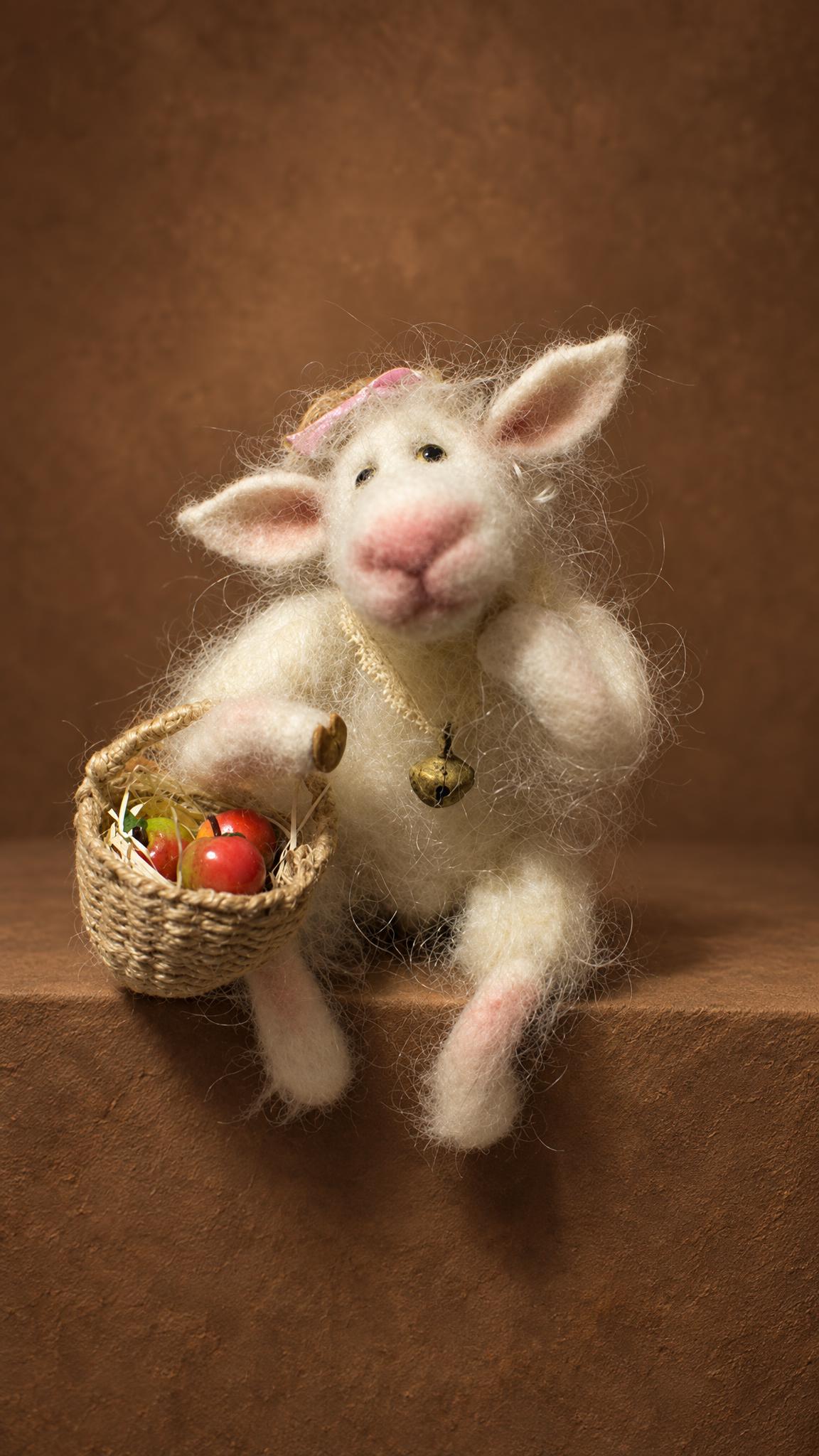 Custom needle felted goat with long wispy white wool, a bell at her neck and tiny apples, made to order