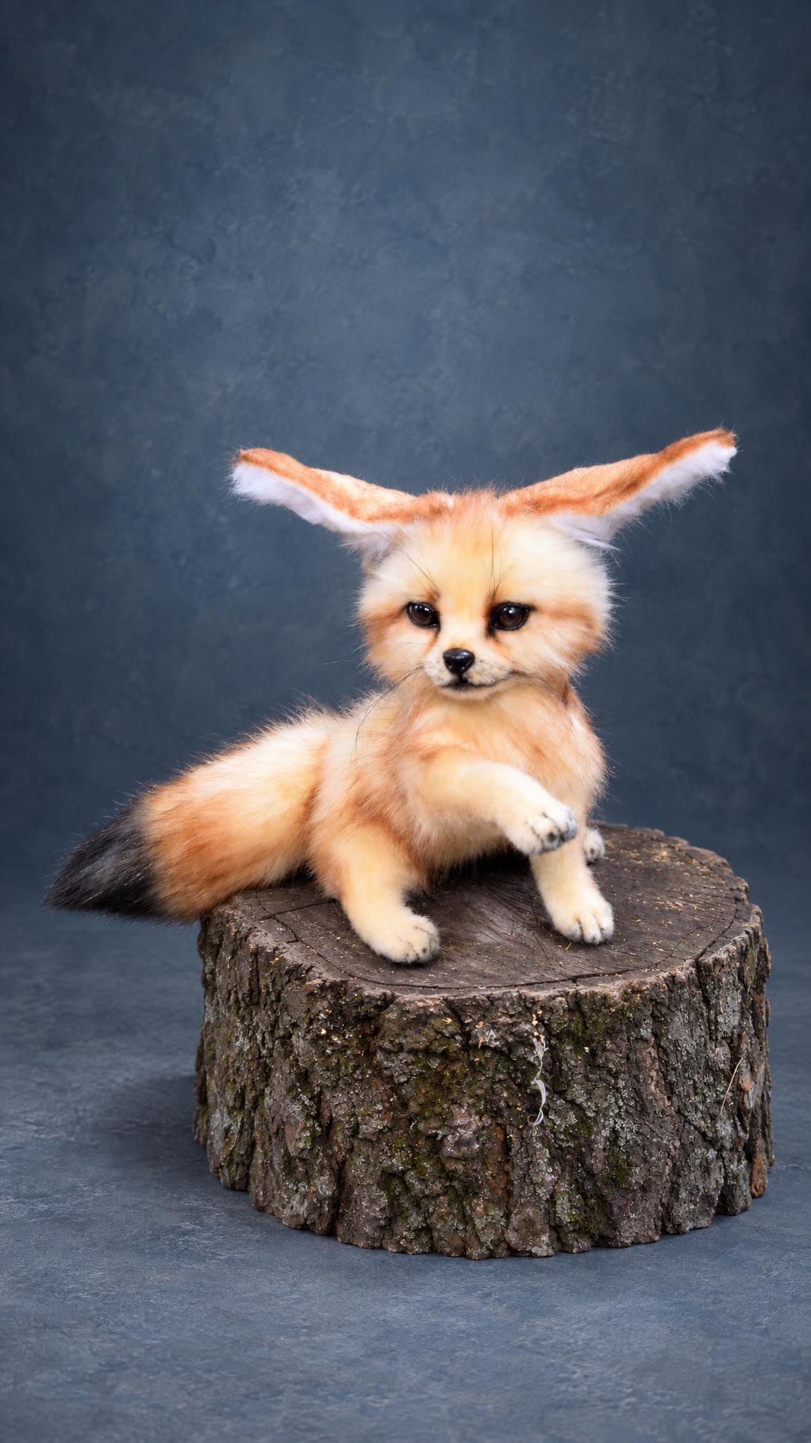Handmade fennec fox plush with its big ears spread out sideways and a paw raised, poseable, made to order