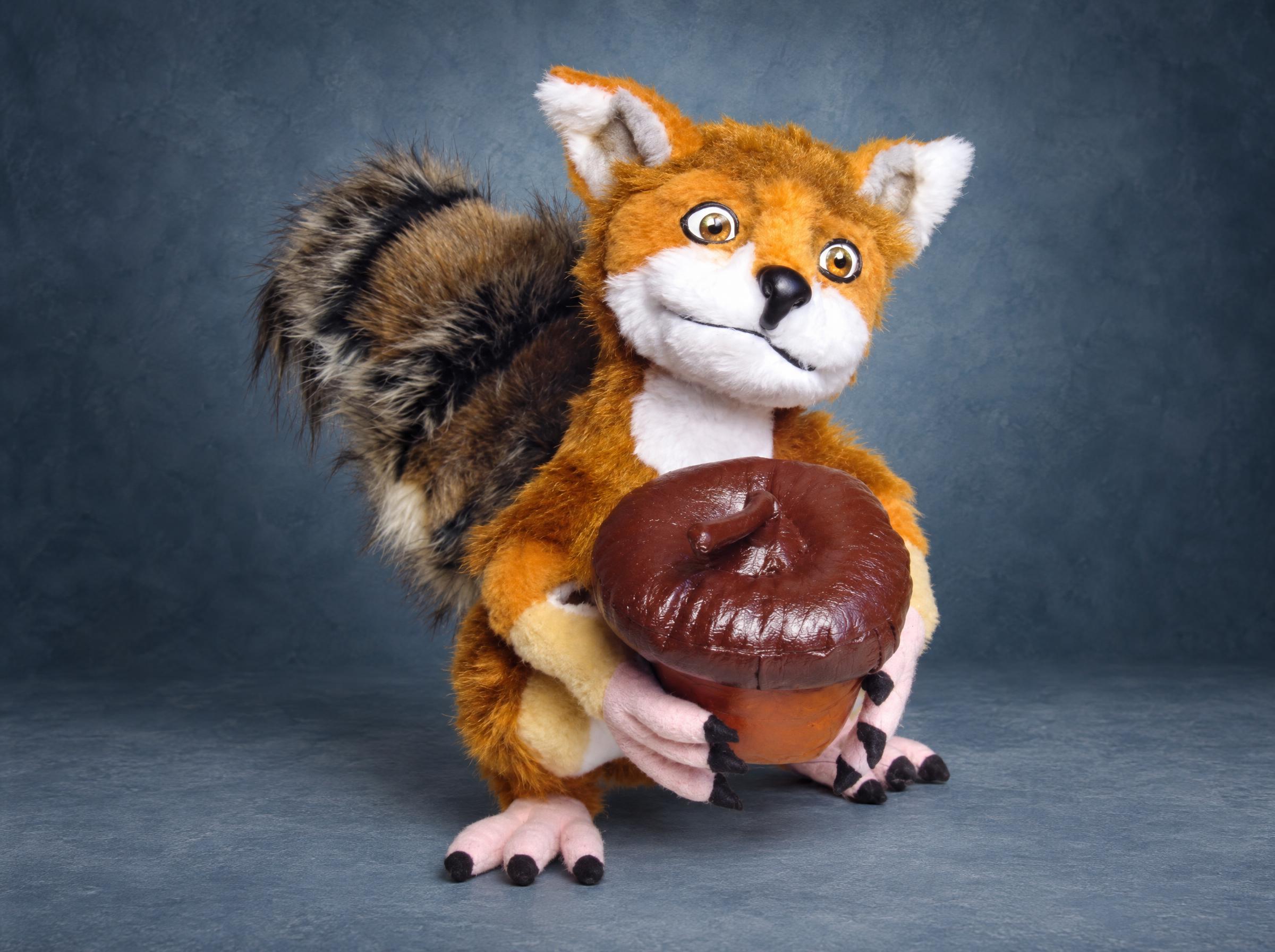 Foxsquirrel plush: a fox meme crossed with the Ice Age squirrel, orange fur, bushy tail and a big acorn, made to order