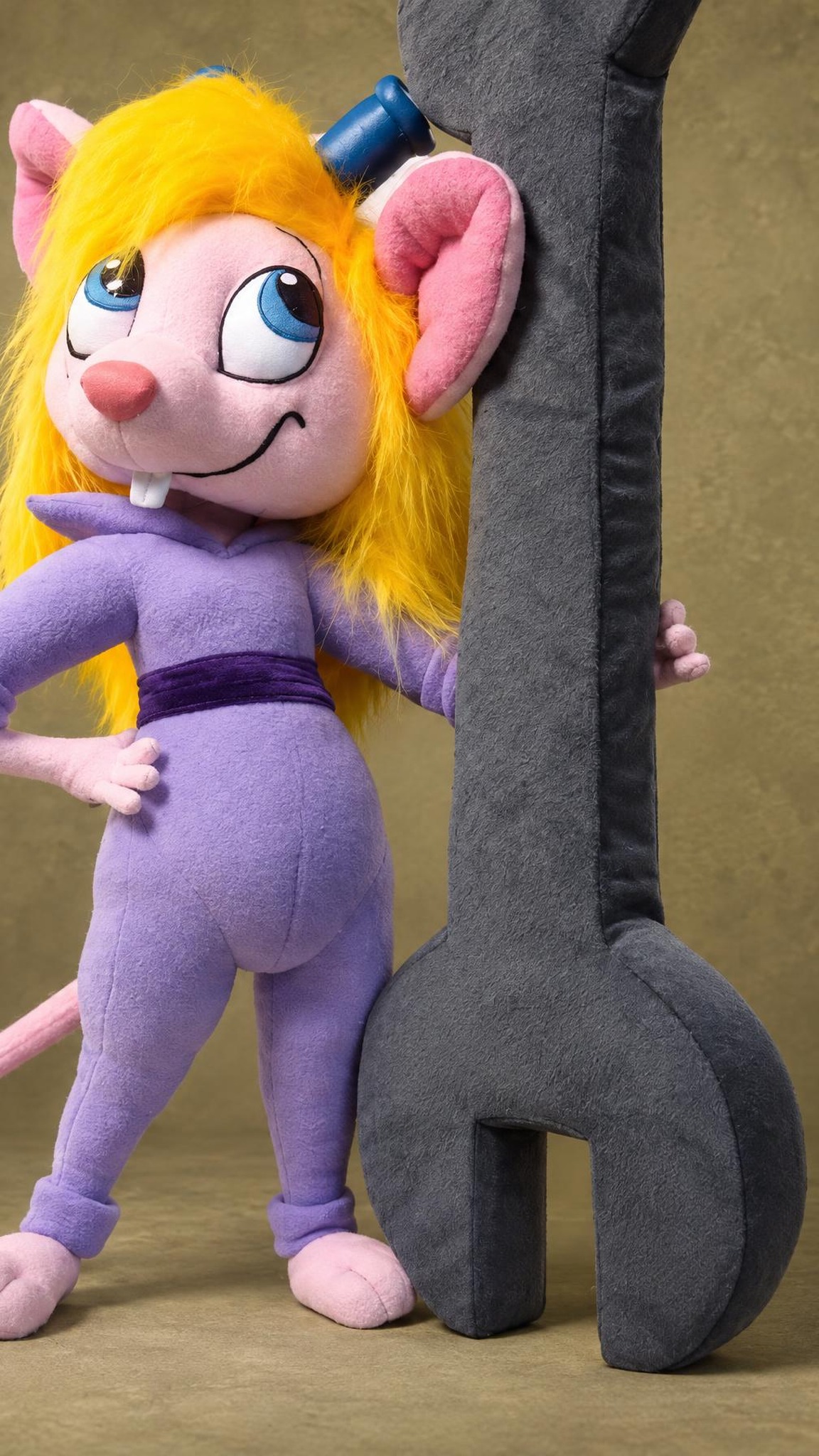 Blonde Gadget Hackwrench plush in lilac coveralls leaning on a giant plush wrench, a custom Disney Afternoon toy