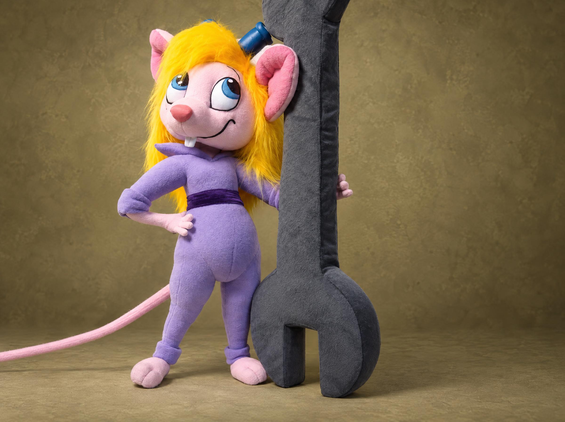 Blonde Gadget Hackwrench plush in lilac coveralls leaning on a giant plush wrench, a custom Disney Afternoon toy