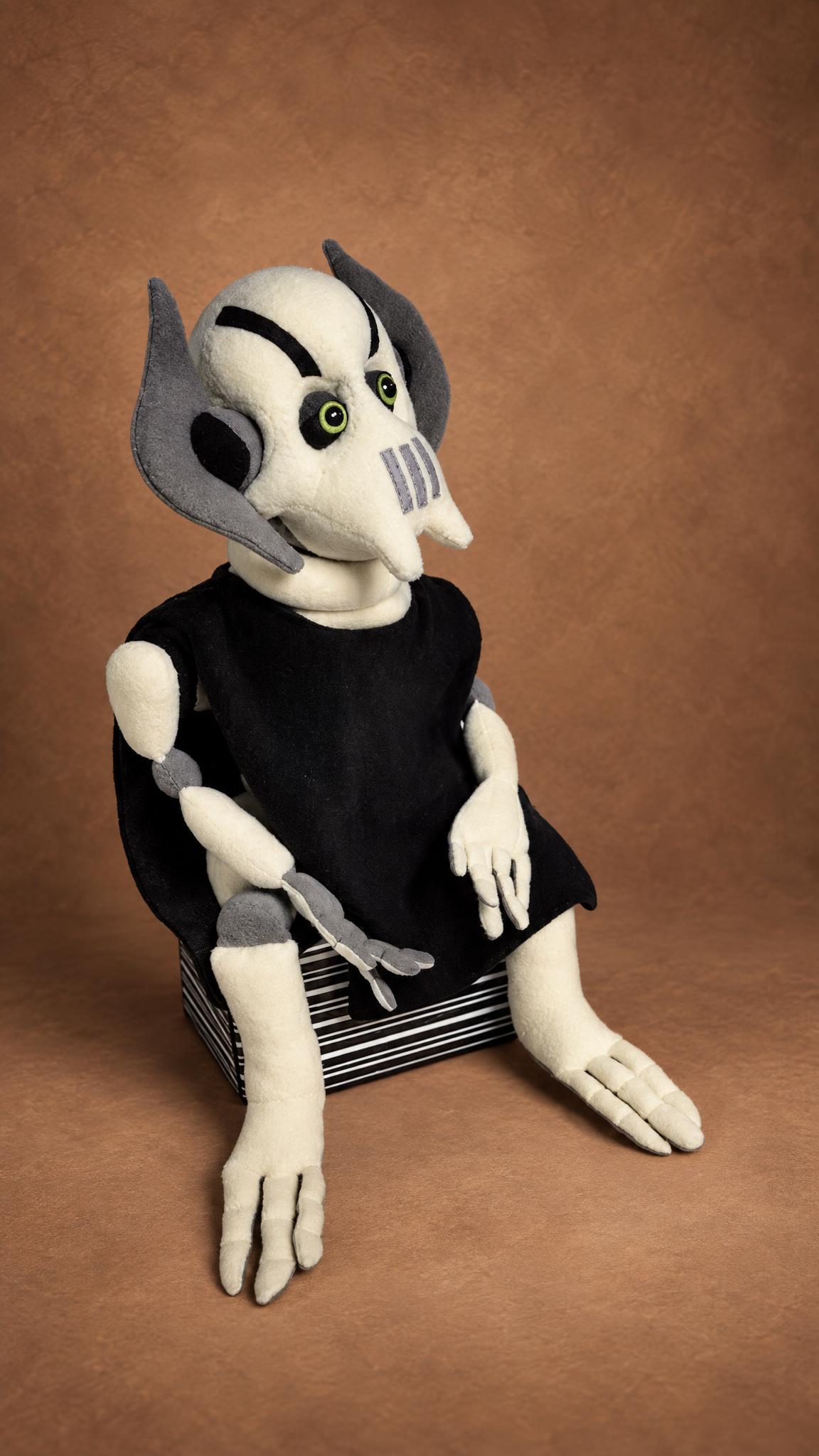 General Grievous plushie with green eyes, grey side plates and a black tunic, a made-to-order Star Wars plush
