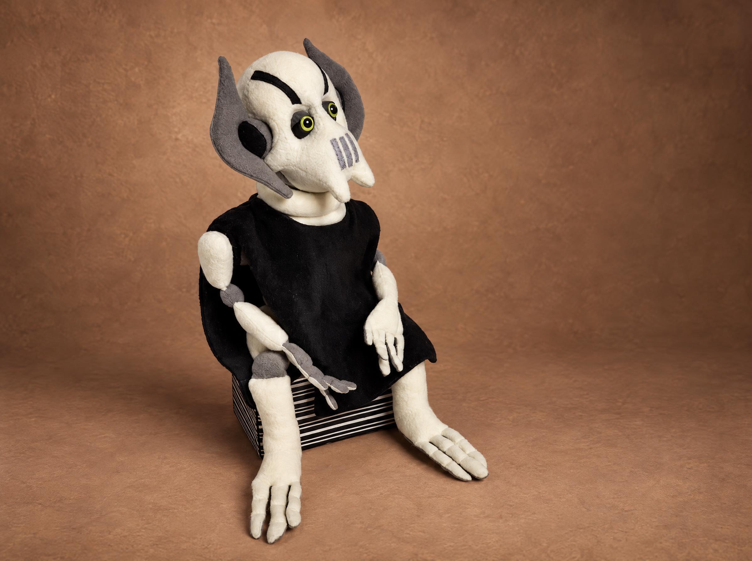 Green-eyed General Grievous plush Custom General Grievous plush with green eyes and heavy dark brows on a striped box, handmade to order