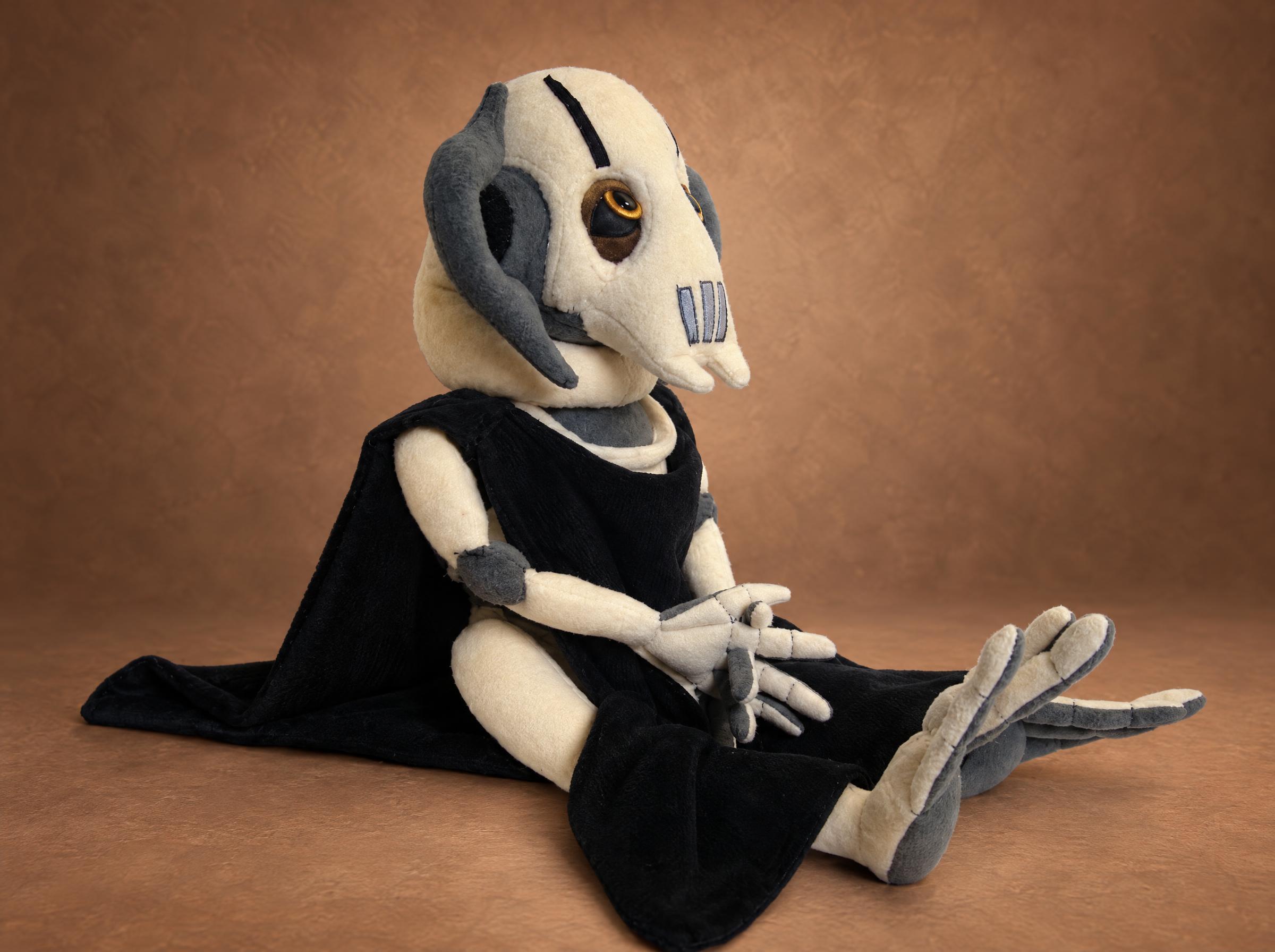 General Grievous stuffed animal with claw feet General Grievous stuffed animal with long jointed arms, claw feet and a navy cloak, a custom Star Wars plush