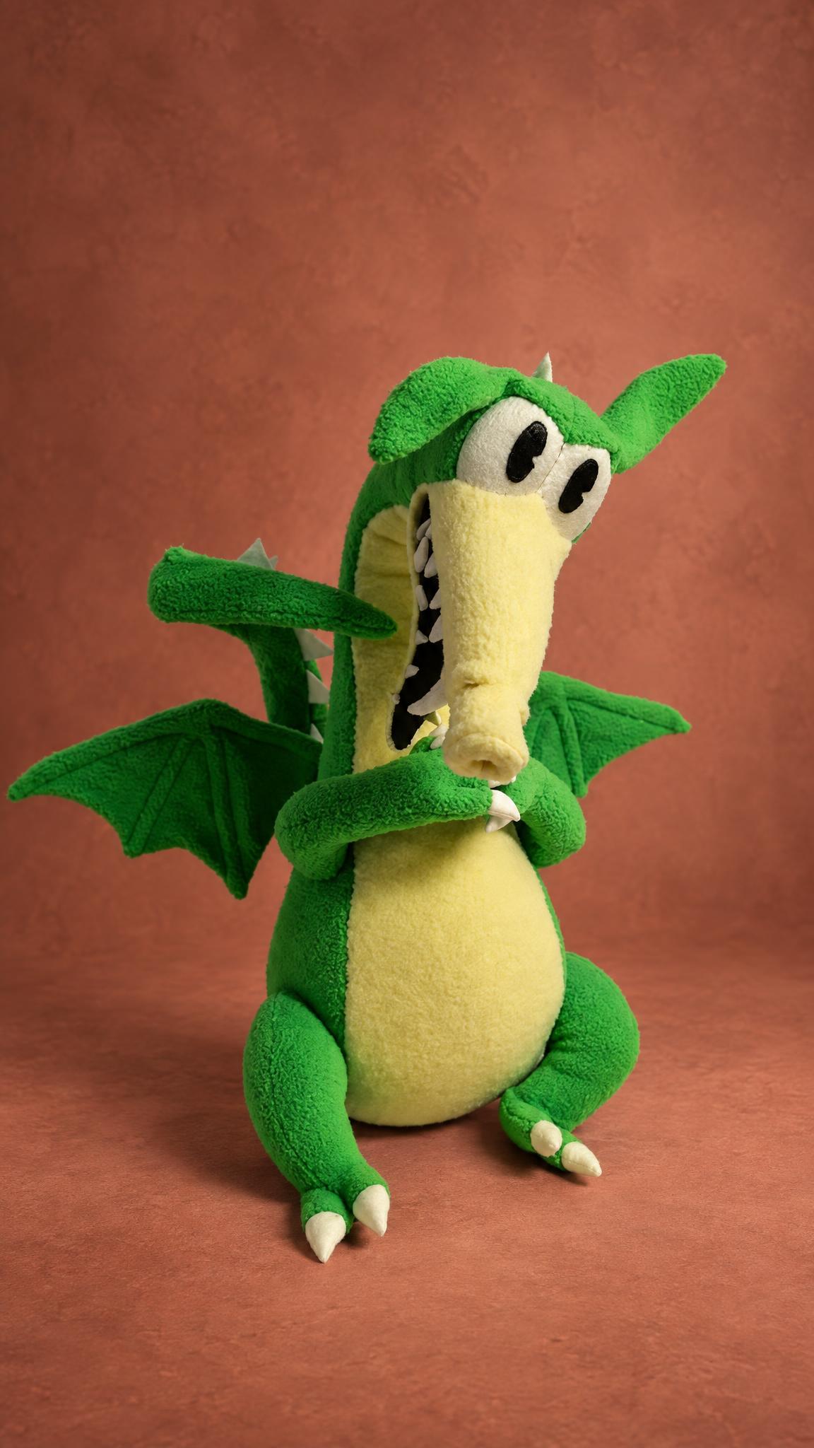 Grim Matchstick dragon plush from Cuphead with green wings spread and a yellow belly, a custom handmade toy