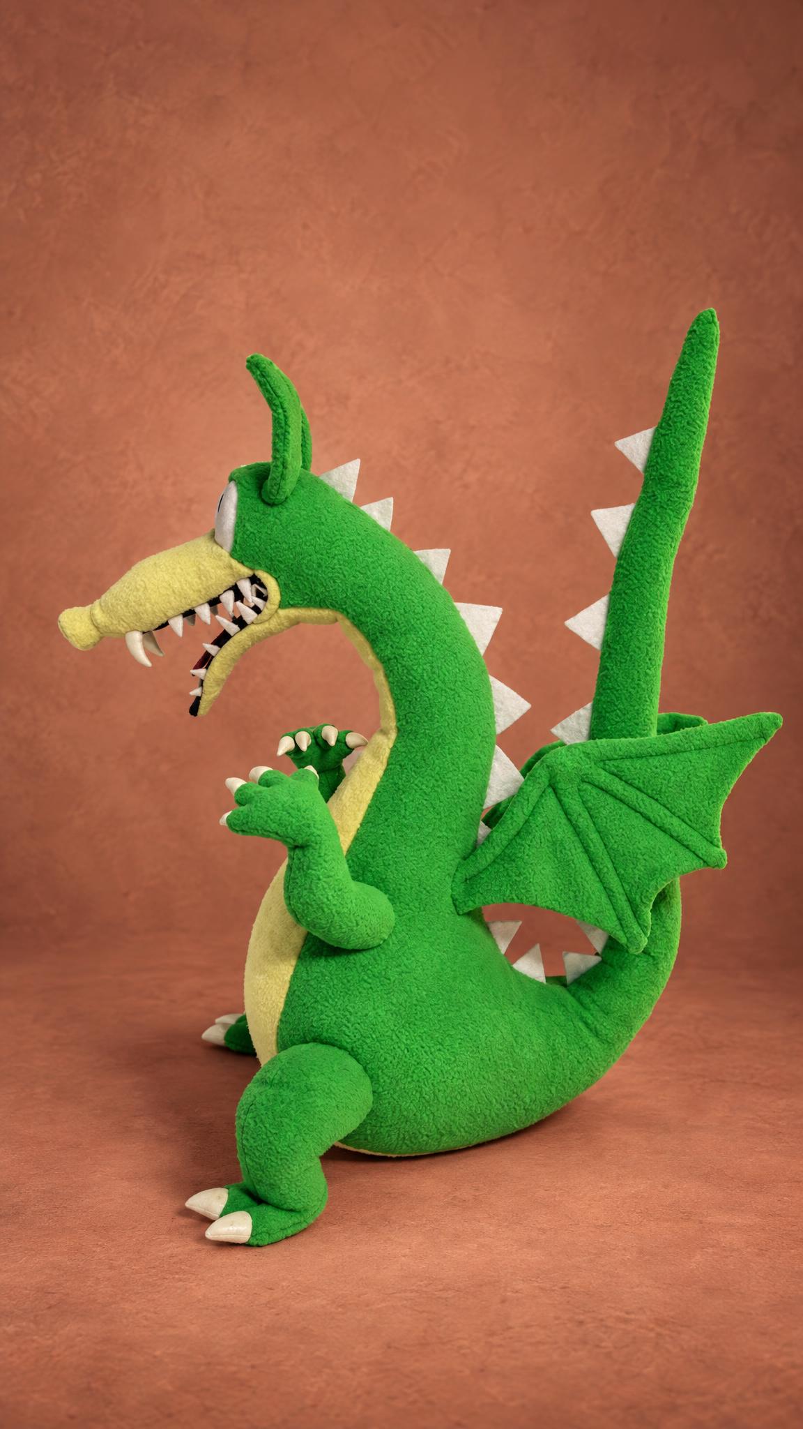 Custom Grim Matchstick soft toy from Cuphead with white spikes, green wings and a curled tail, made to order