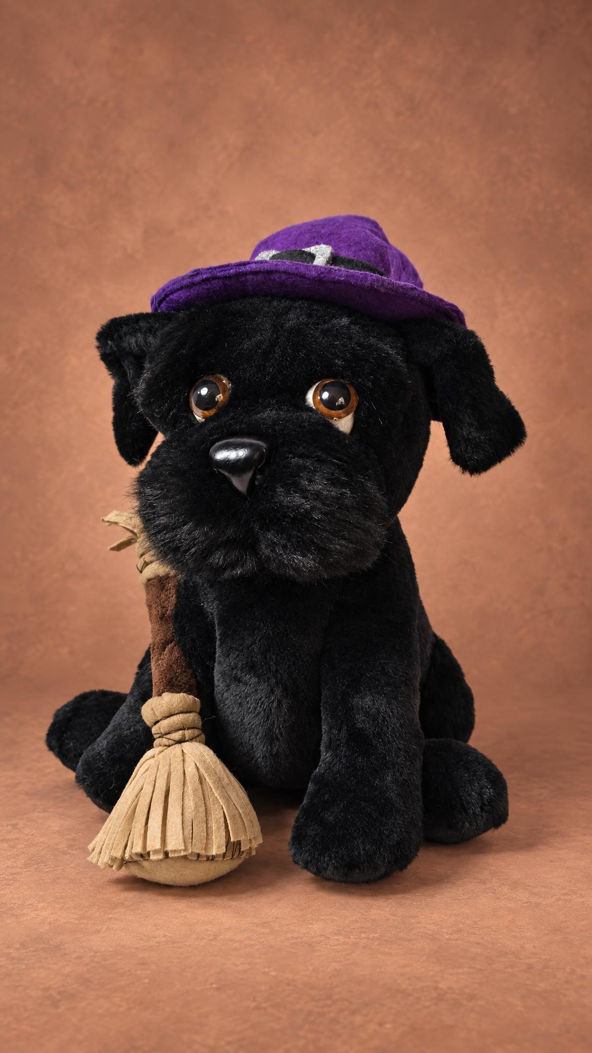 Handmade dog mascot plush with big brown eyes, a shiny black nose and a fringed broom, a black terrier to order