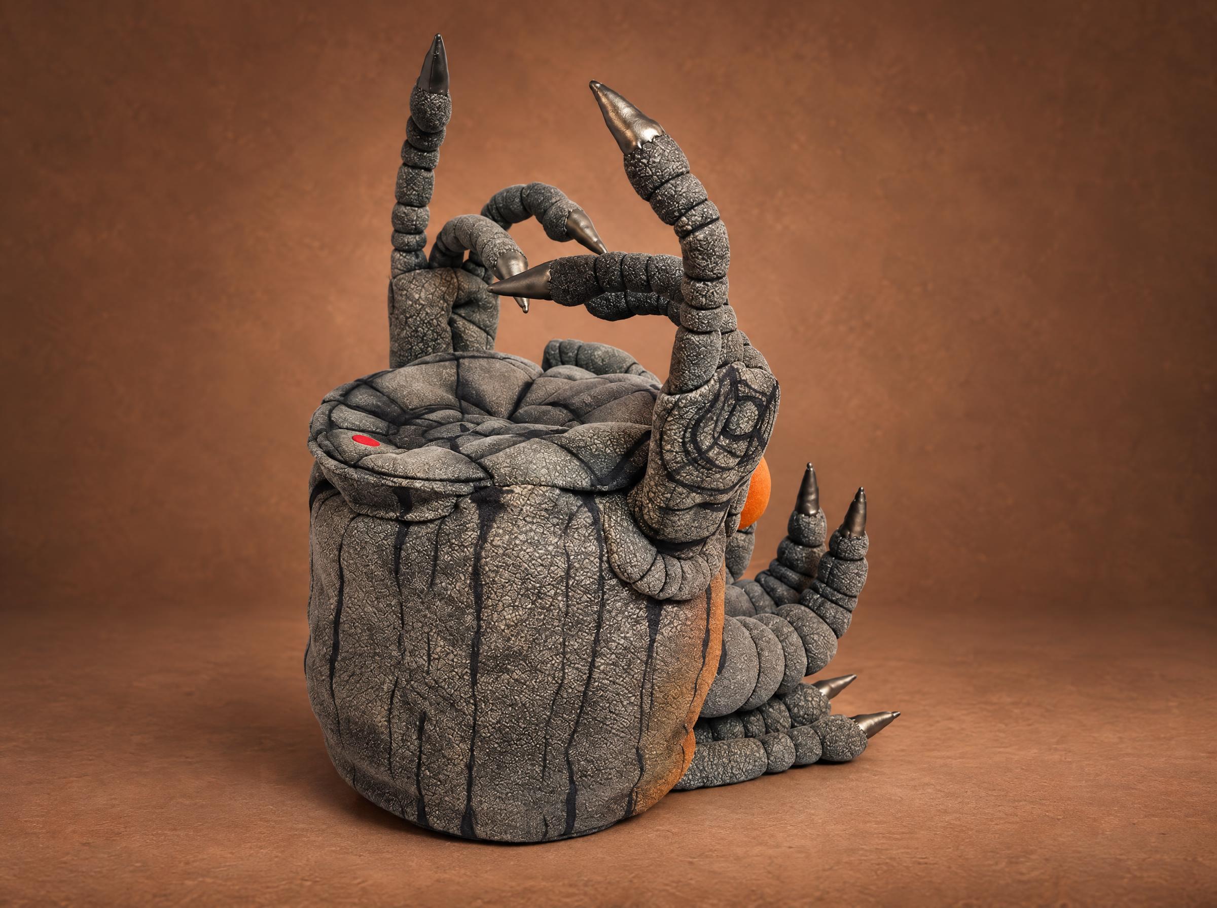 Handmade Epic Noggin toy with segmented clawed arms Handmade Epic Noggin toy with tall segmented arms and metallic claws on a cracked stone drum, custom MSM plush