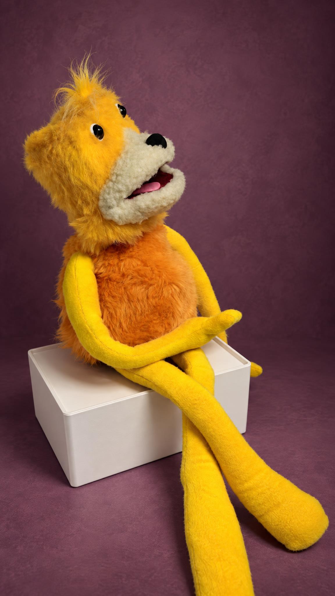 Handmade Flat Eric puppet from the Mr. Oizo Levi's ads, sewn to order, looking up with his pink tongue out