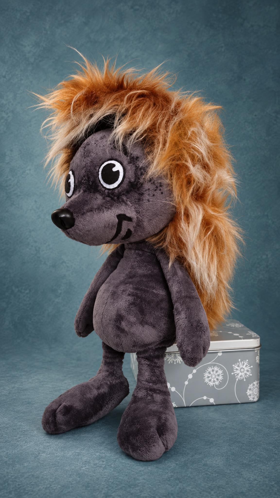 Handmade hedgehog plush with long ginger faux fur spines and a black button nose, custom Tryam toy to order