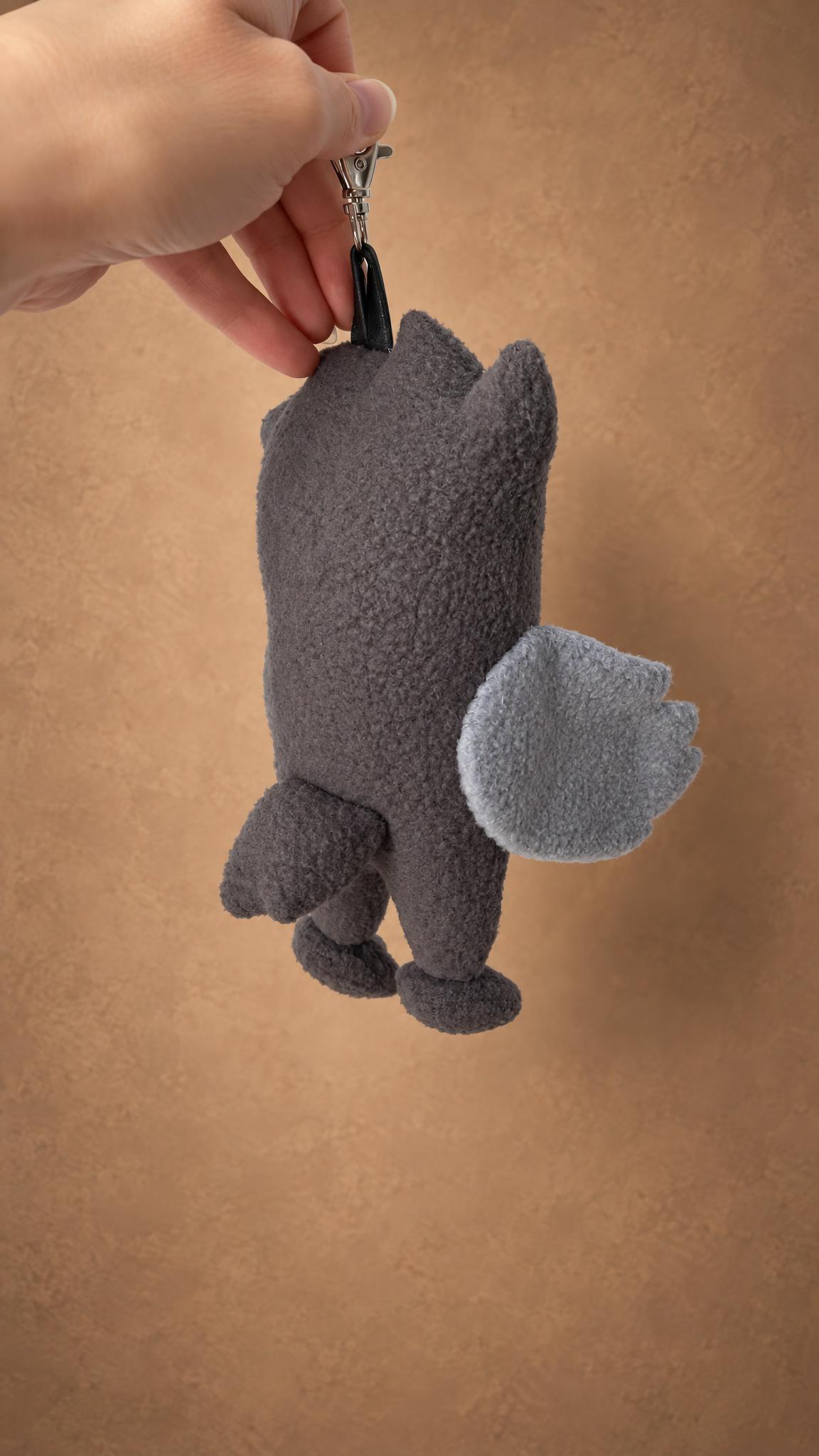 Handmade monster keychain plush in charcoal fleece, scalloped wing and clawed feet, custom made to order