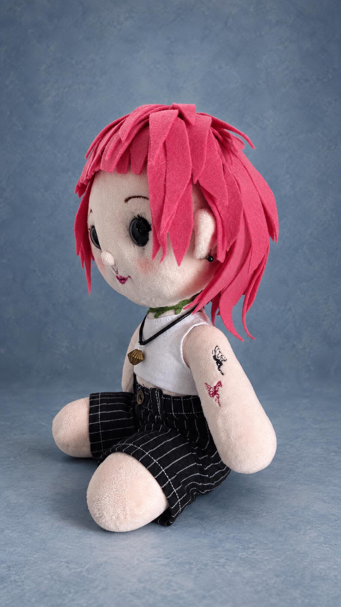 Handmade portrait doll with a pink felt wig and stitched tattoos on her arm, made to order from a photo