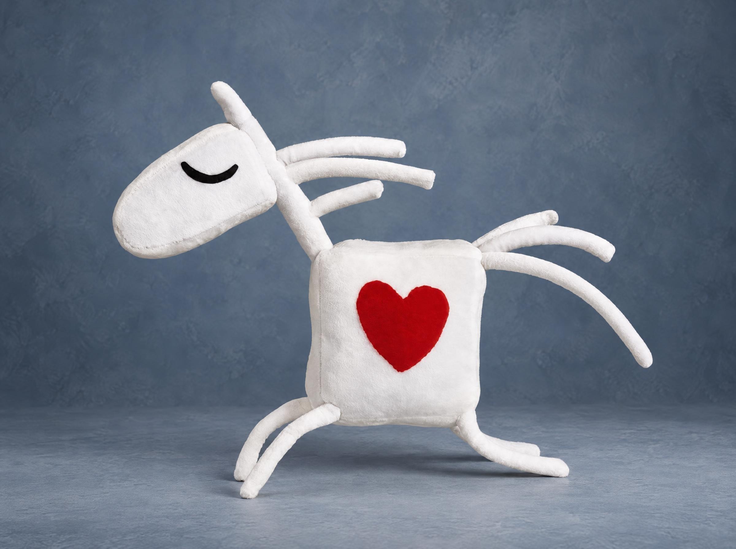 White horse mascot plush with a red heart and sleepy closed eyes, custom made for a kids' riding club