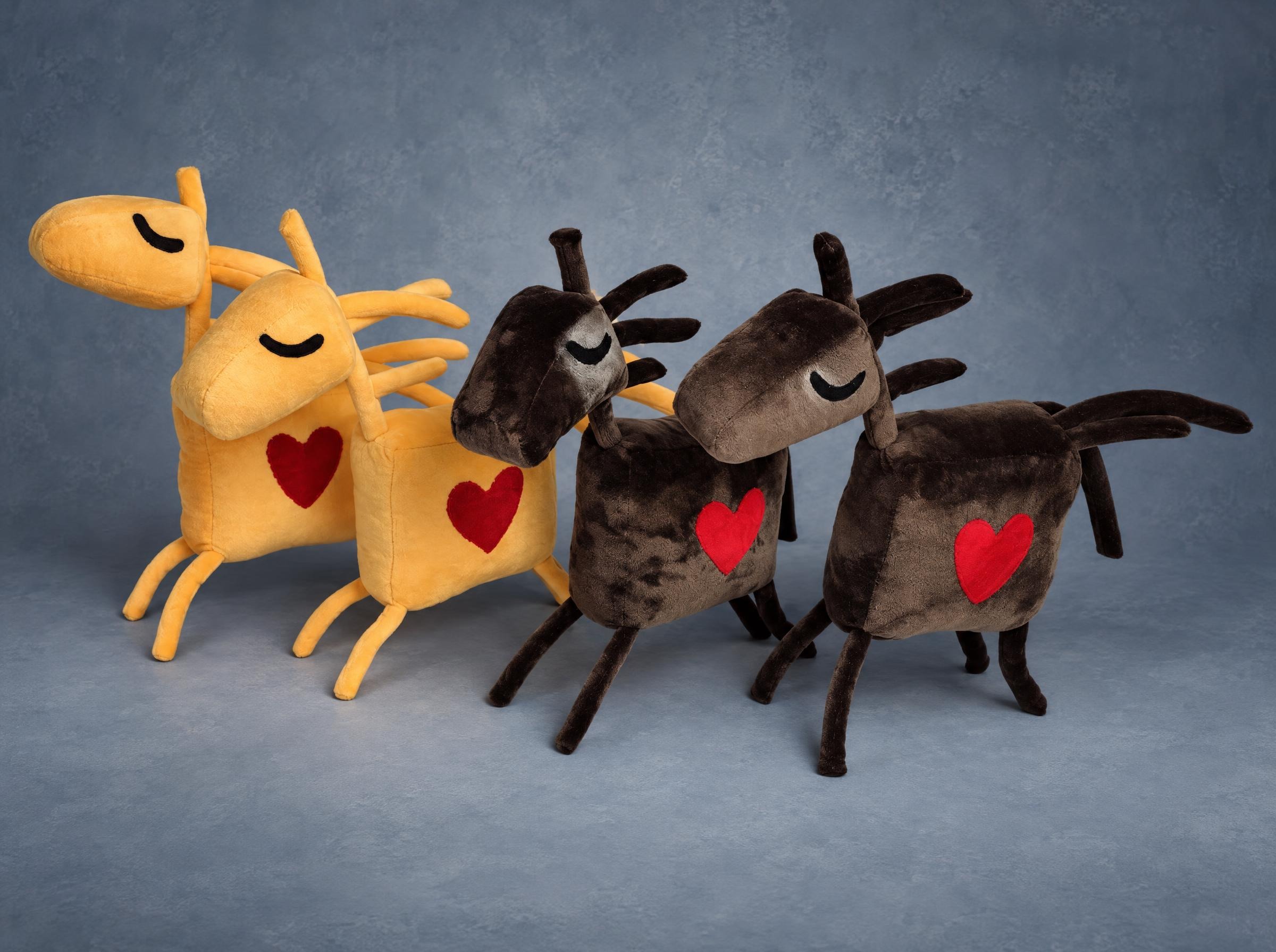 Horse mascot plushes in yellow and brown Four handmade horse mascot plushes, two warm yellow and two chocolate brown, each with a red heart
