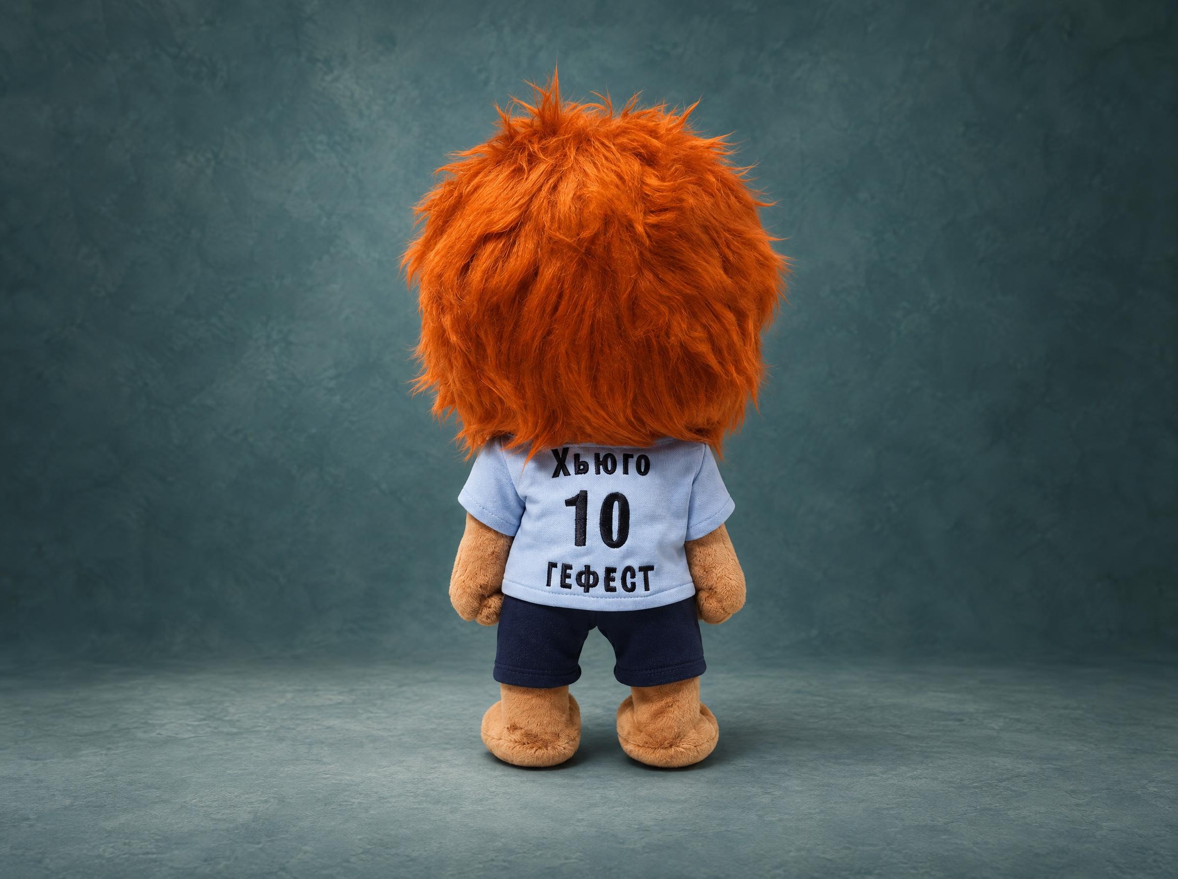Hugo lion mascot plush with his name and number 10 embroidered on the back of his FC Gefest shirt, made to order